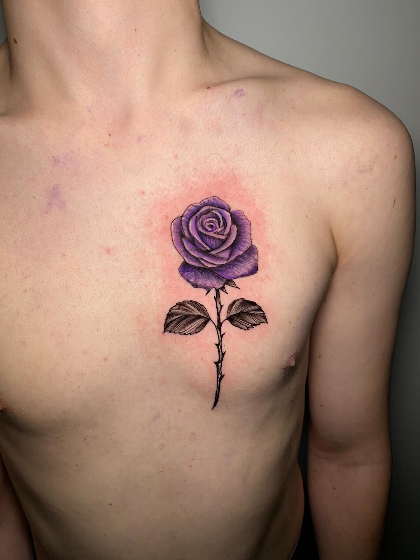 Purple rose realism tattoo on the chest by @dom_macio_tattoo