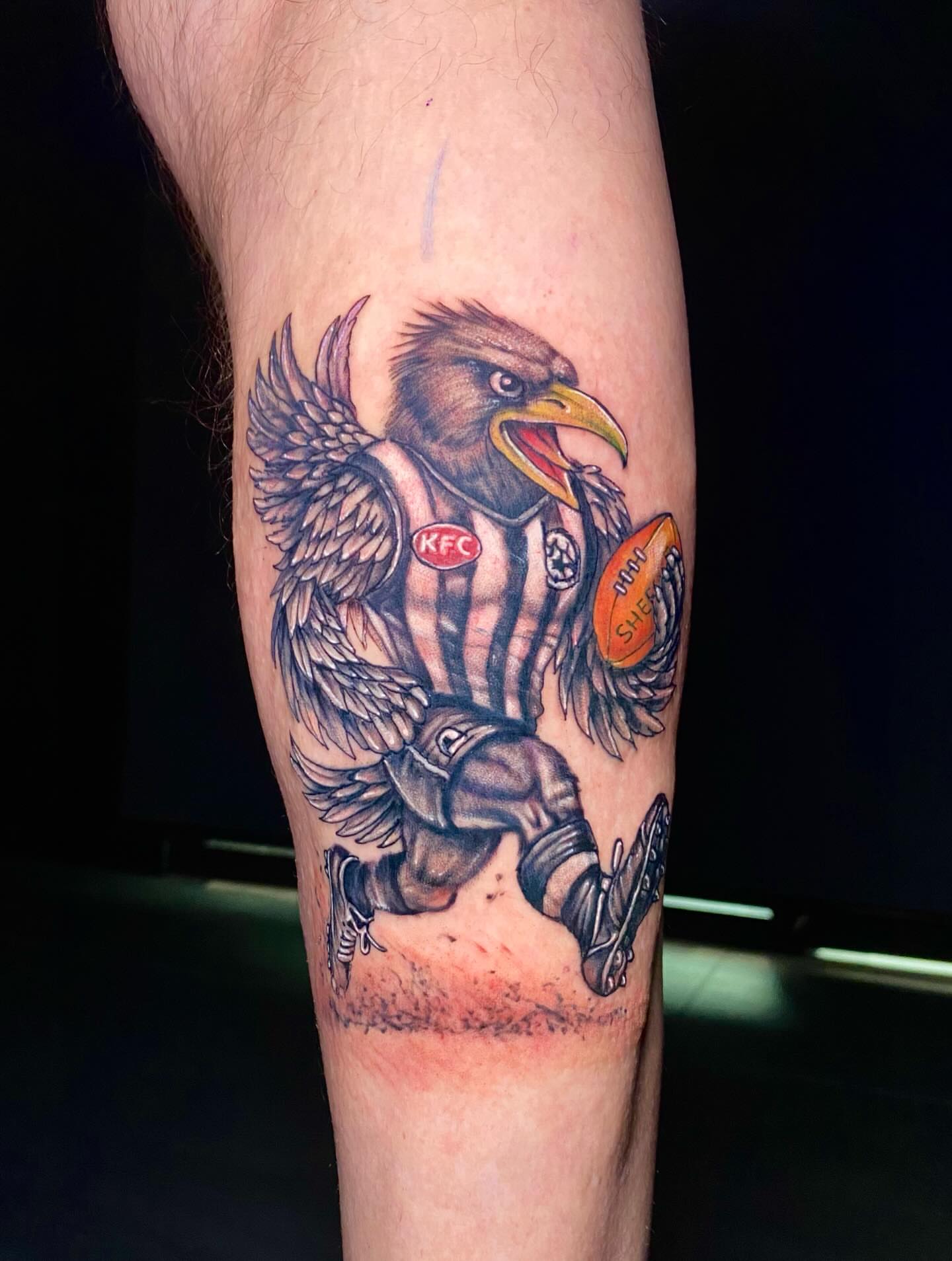 Eagle with football American traditional tattoo on the forearm by @dom_macio_tattoo