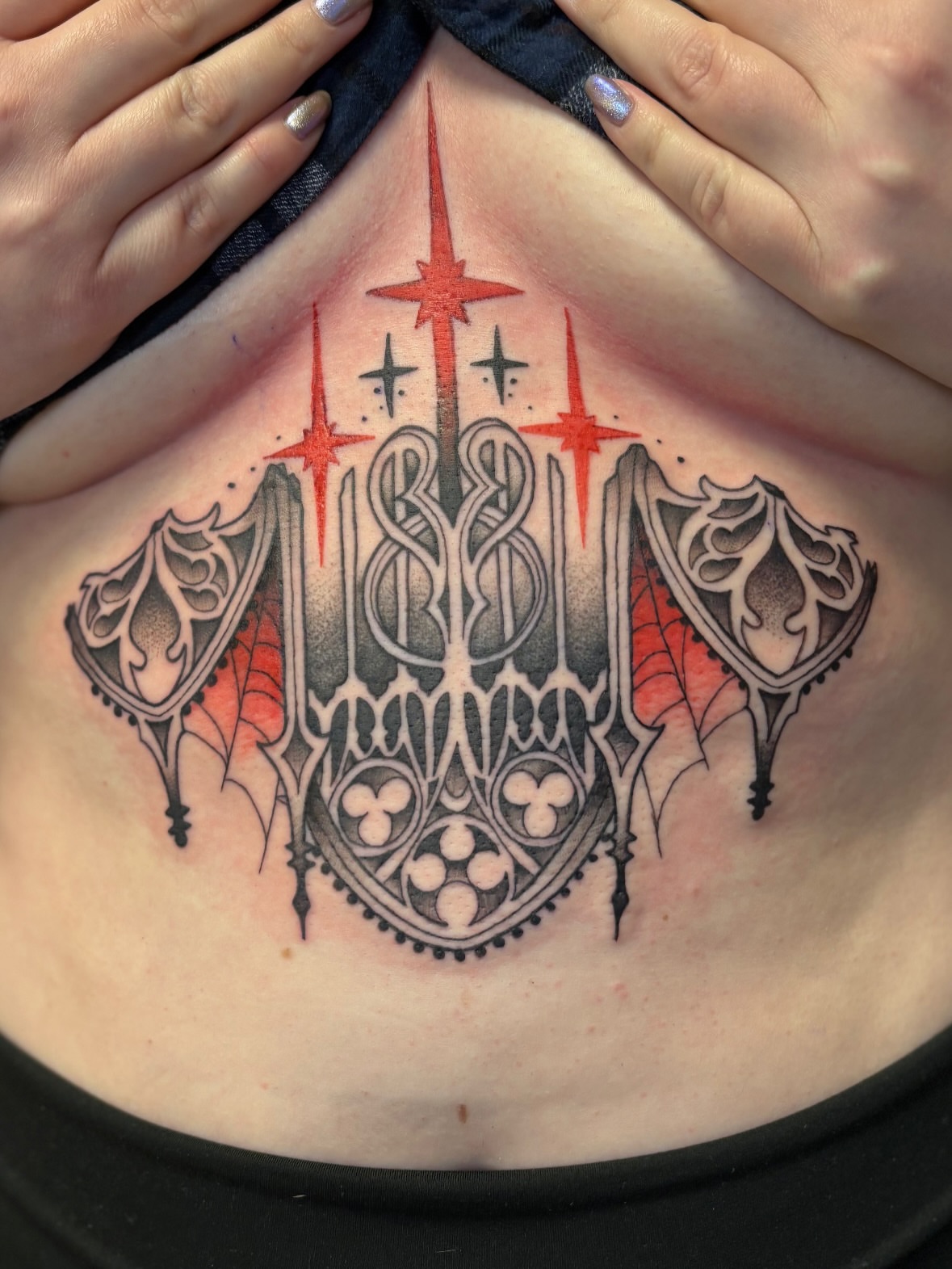 Gothic emblem ornamental tattoo on the chest by Dee - MA Tattoo Artist, Concord, Massachusetts