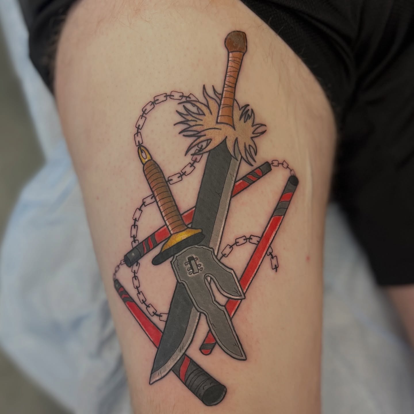 Crossed swords and chain American traditional tattoo on the thigh by Leslie Paskoff