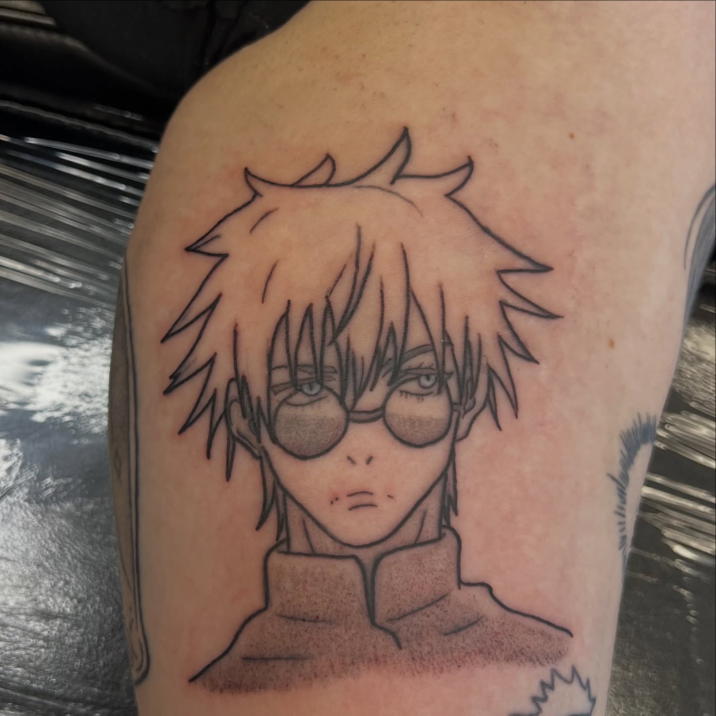 Anime character anime tattoo on the shoulder by Leslie Paskoff