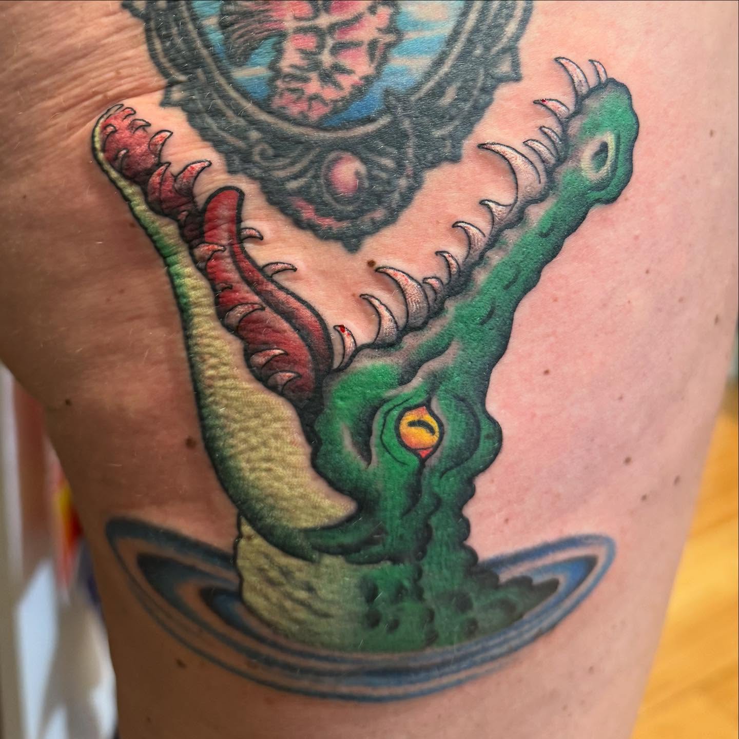 Serpent American traditional tattoo on the thigh by Tony Beuke
