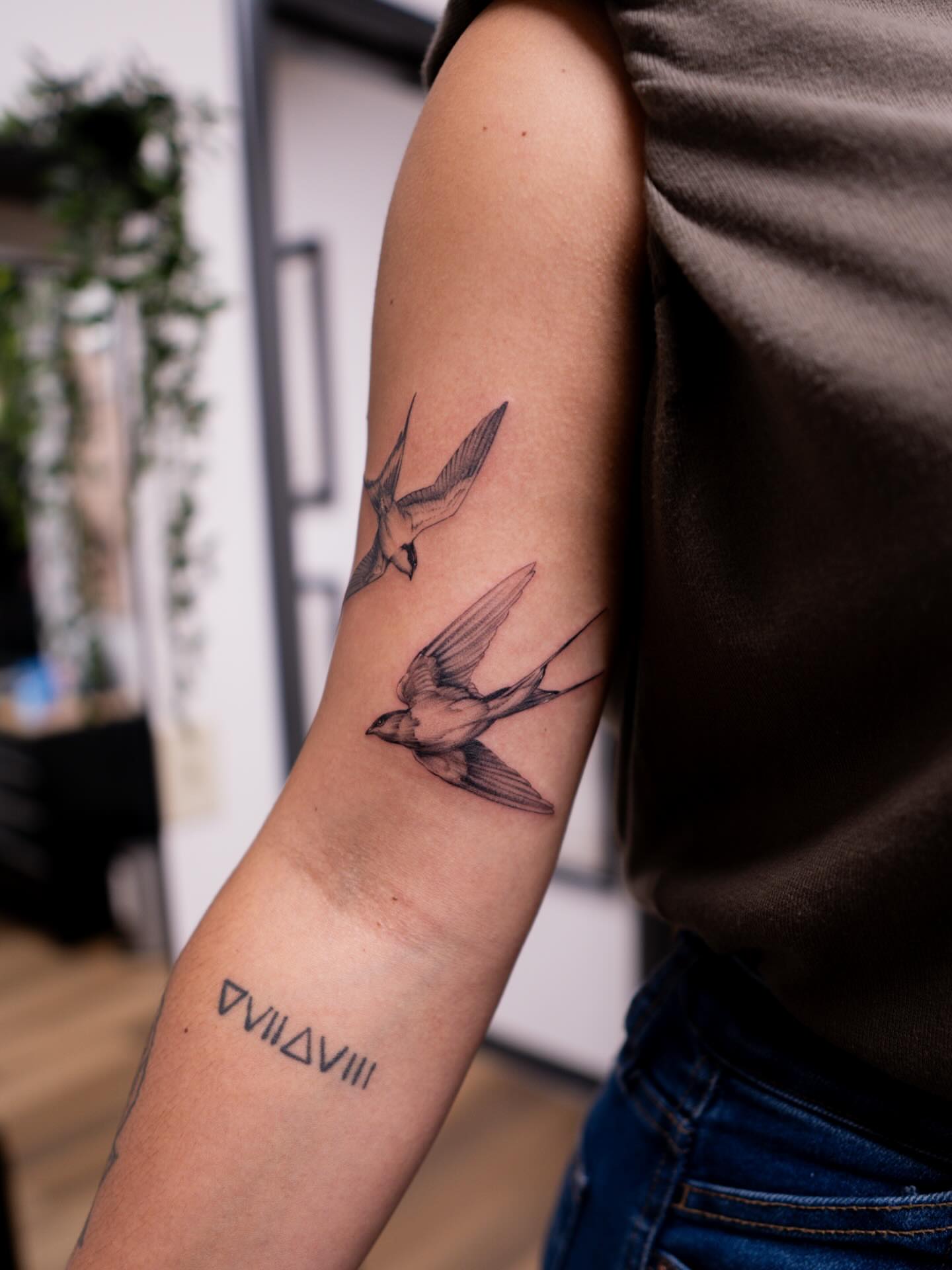 Swallows realism tattoo on the forearm by Adriano Bassalo