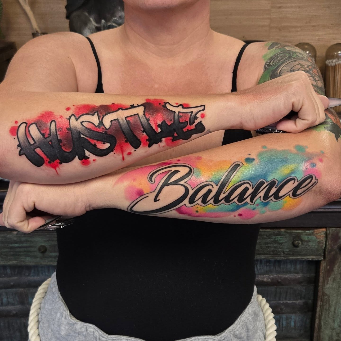 HUSTLE lettering script tattoo on the forearm by Brian Savage, Gilbert, Arizona