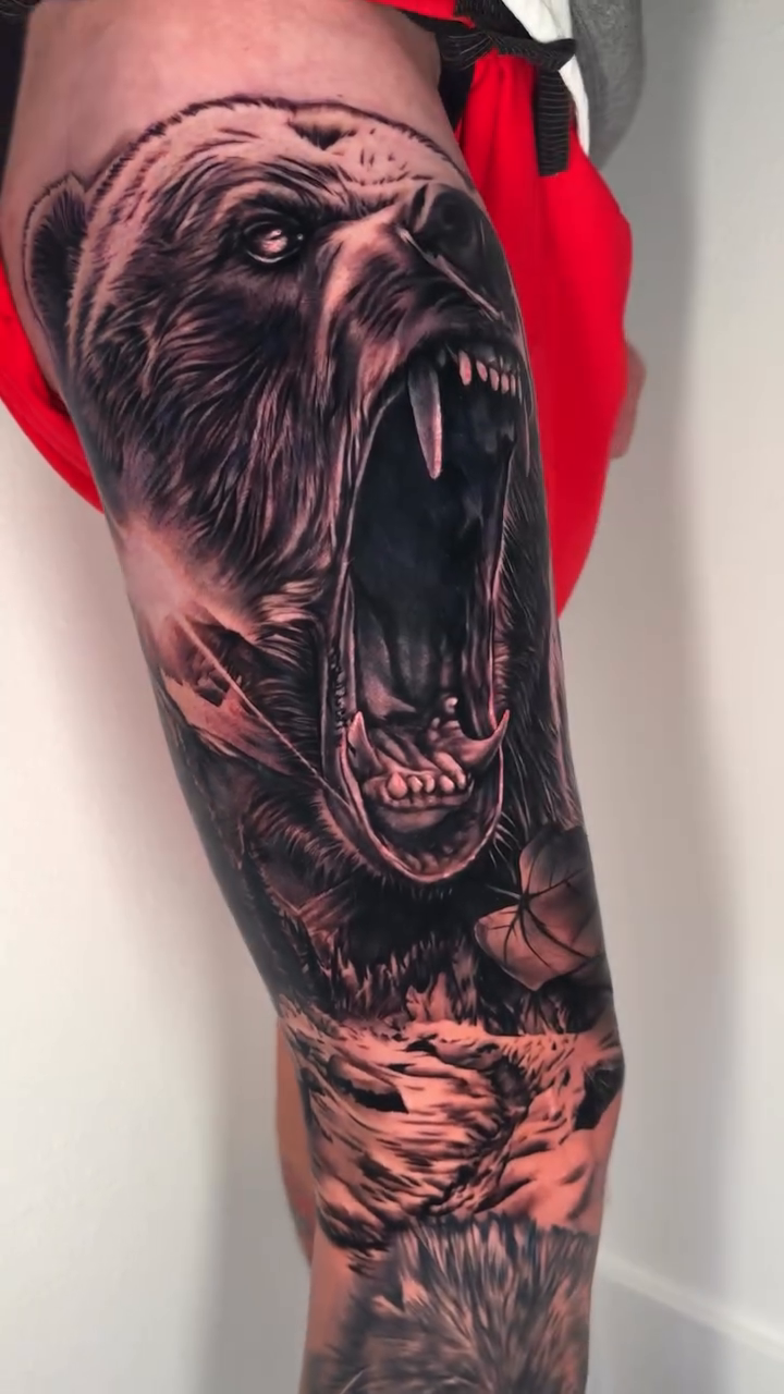 Bear and wolf leg sleeve realism tattoo by Dakota Case