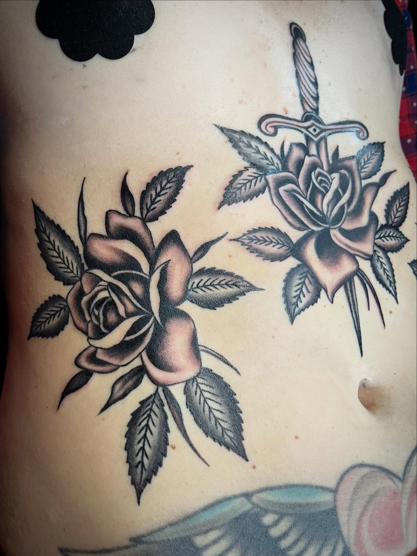 Roses and sword American traditional tattoo on the ribs by holly danesi . philadelphia tattoo, Philadelphia, Pennsylvania