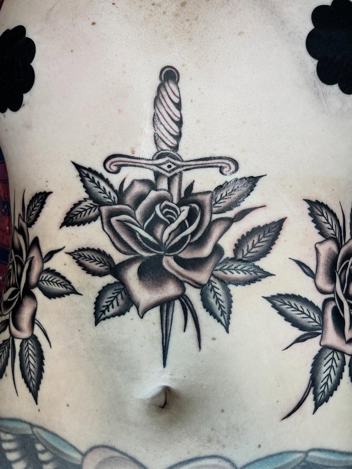 Sword through rose American traditional tattoo on the torso by holly danesi . philadelphia tattoo, Philadelphia, Pennsylvania