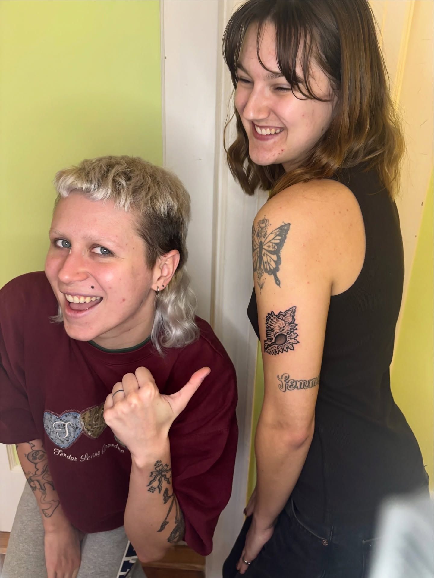 Butterfly dotwork tattoo on the upper arm by Grae