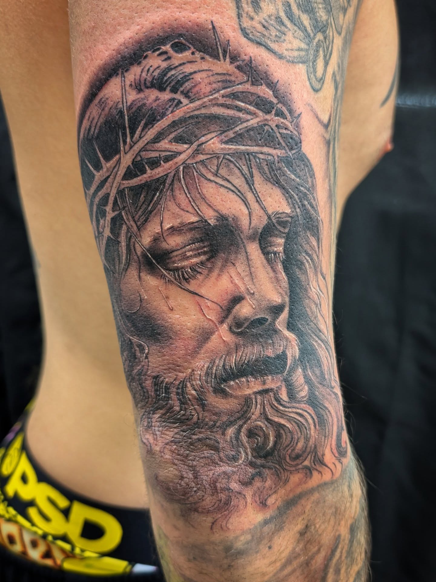 Jesus Christ realism tattoo on the forearm by Katherine