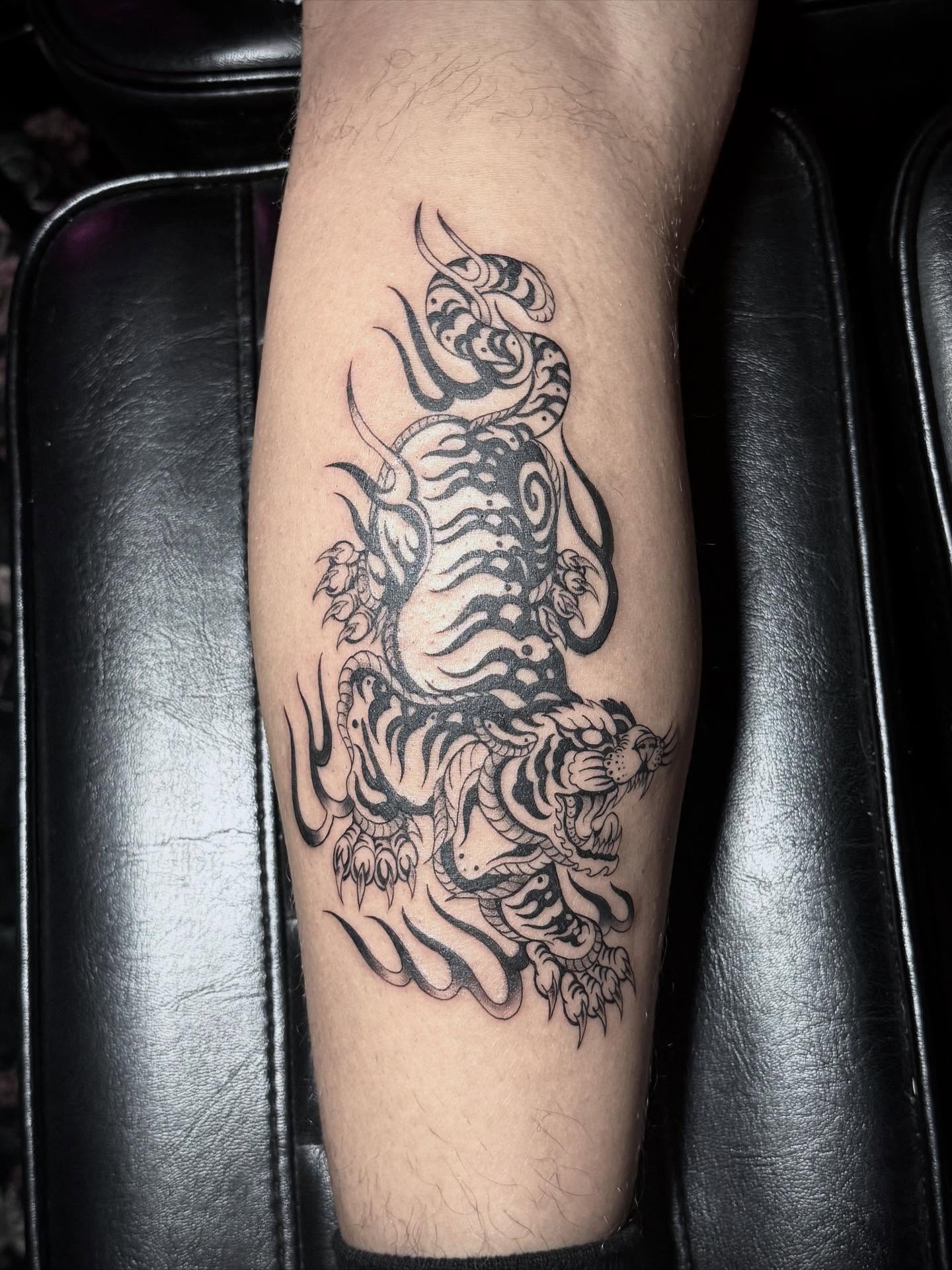 Dragon black and grey tattoo on the forearm by abbie michelle