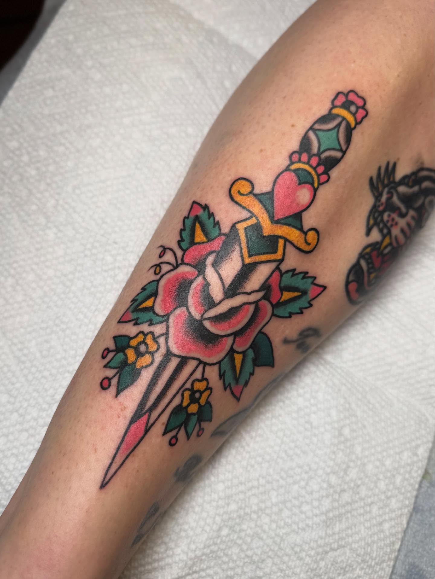 Sword and rose American traditional tattoo on the forearm by Elle Yax