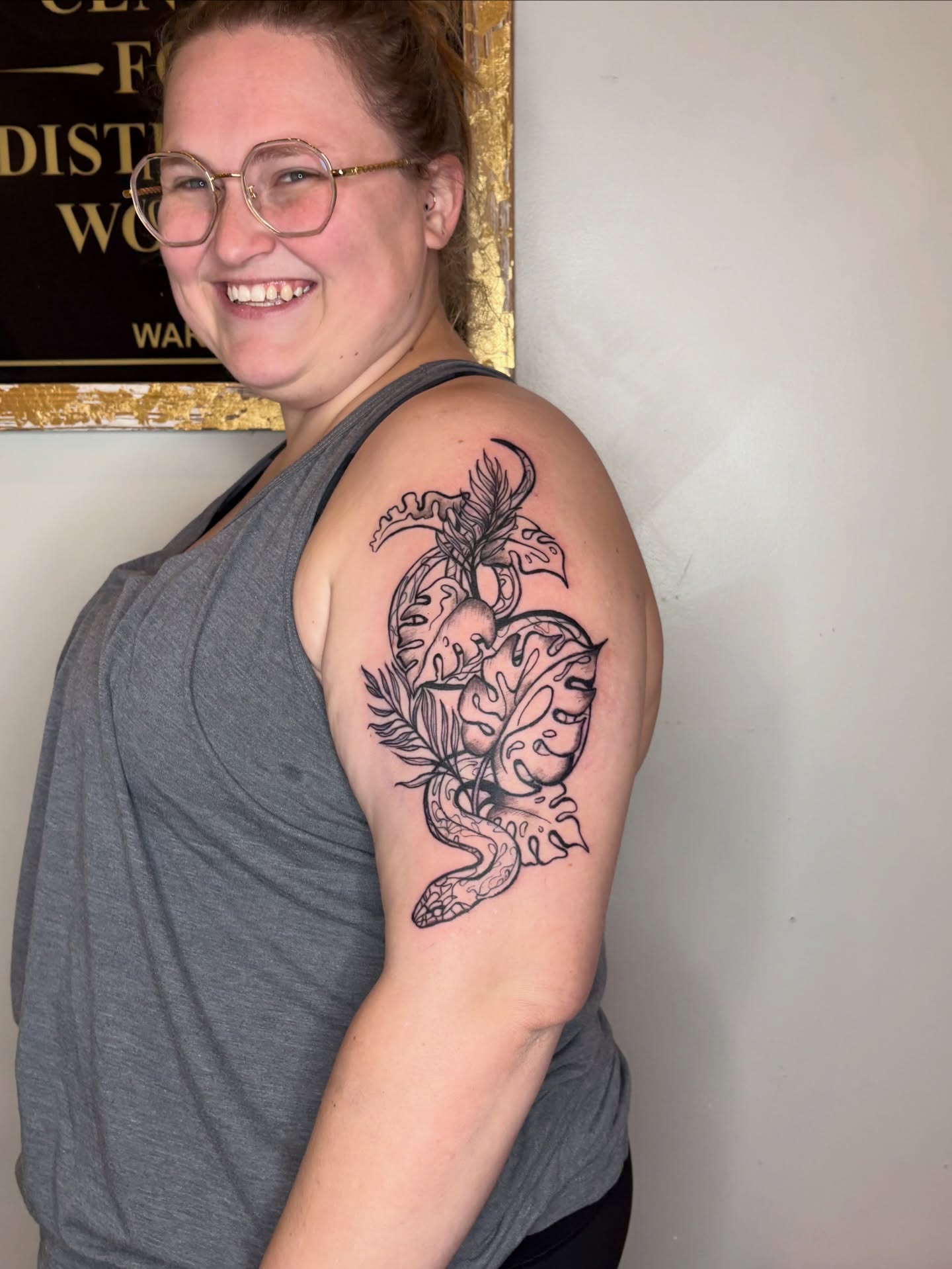 Snake and heart black and grey tattoo on the shoulder by Sarah