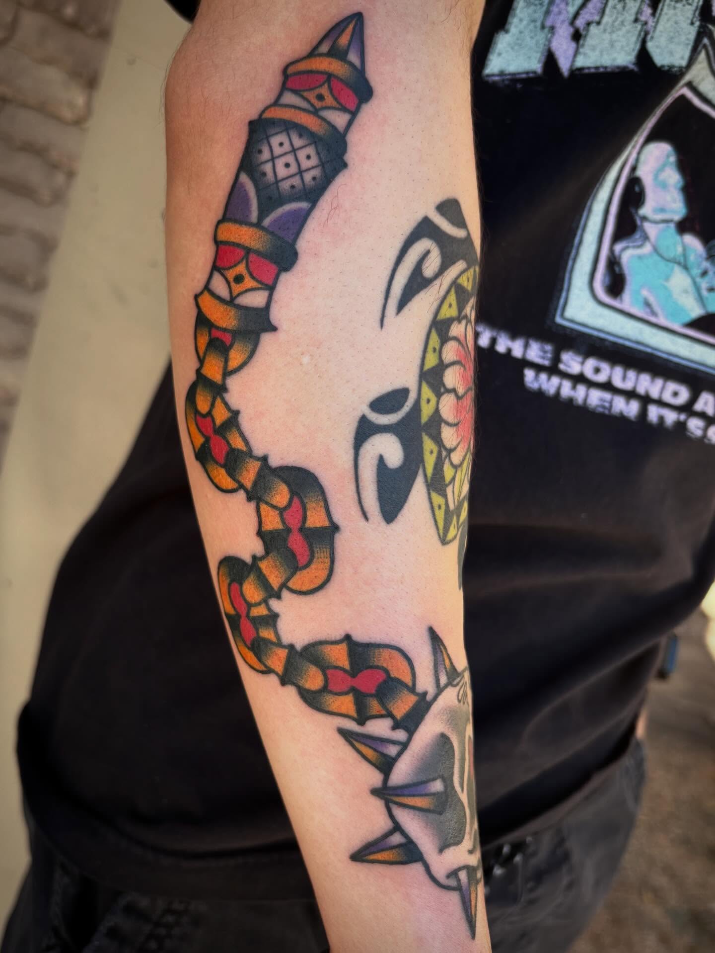 Snake and peony American traditional tattoo on the forearm by Allyson Monique