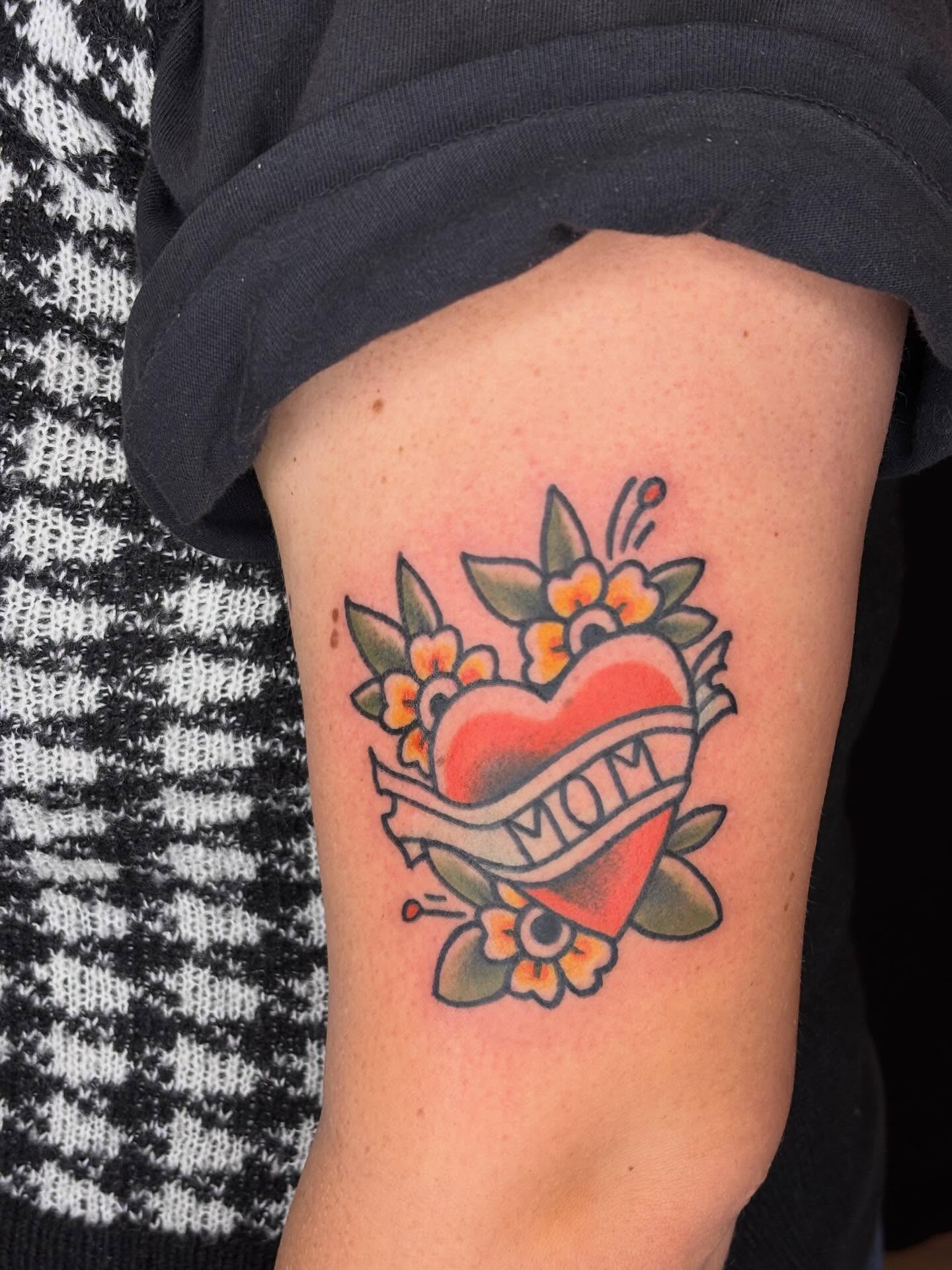 Heart with flowers American traditional tattoo on the forearm by π»πΈπ½π½, Ypsilanti, Michigan