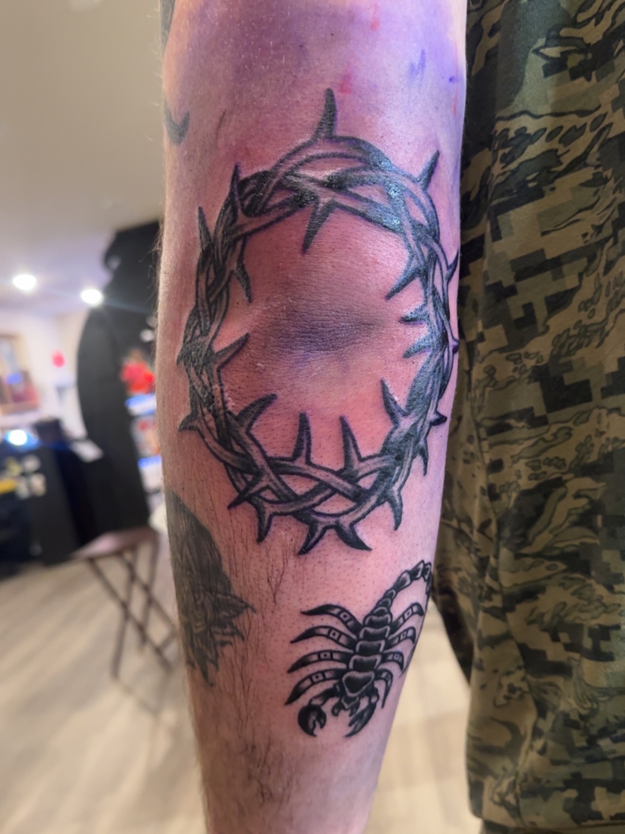 Crown of thorns black and grey tattoo on the forearm by Minneapolis