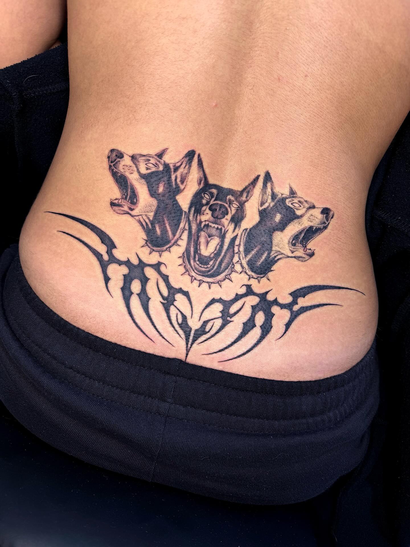Three wolves tribal tattoo on the ribs by sarah