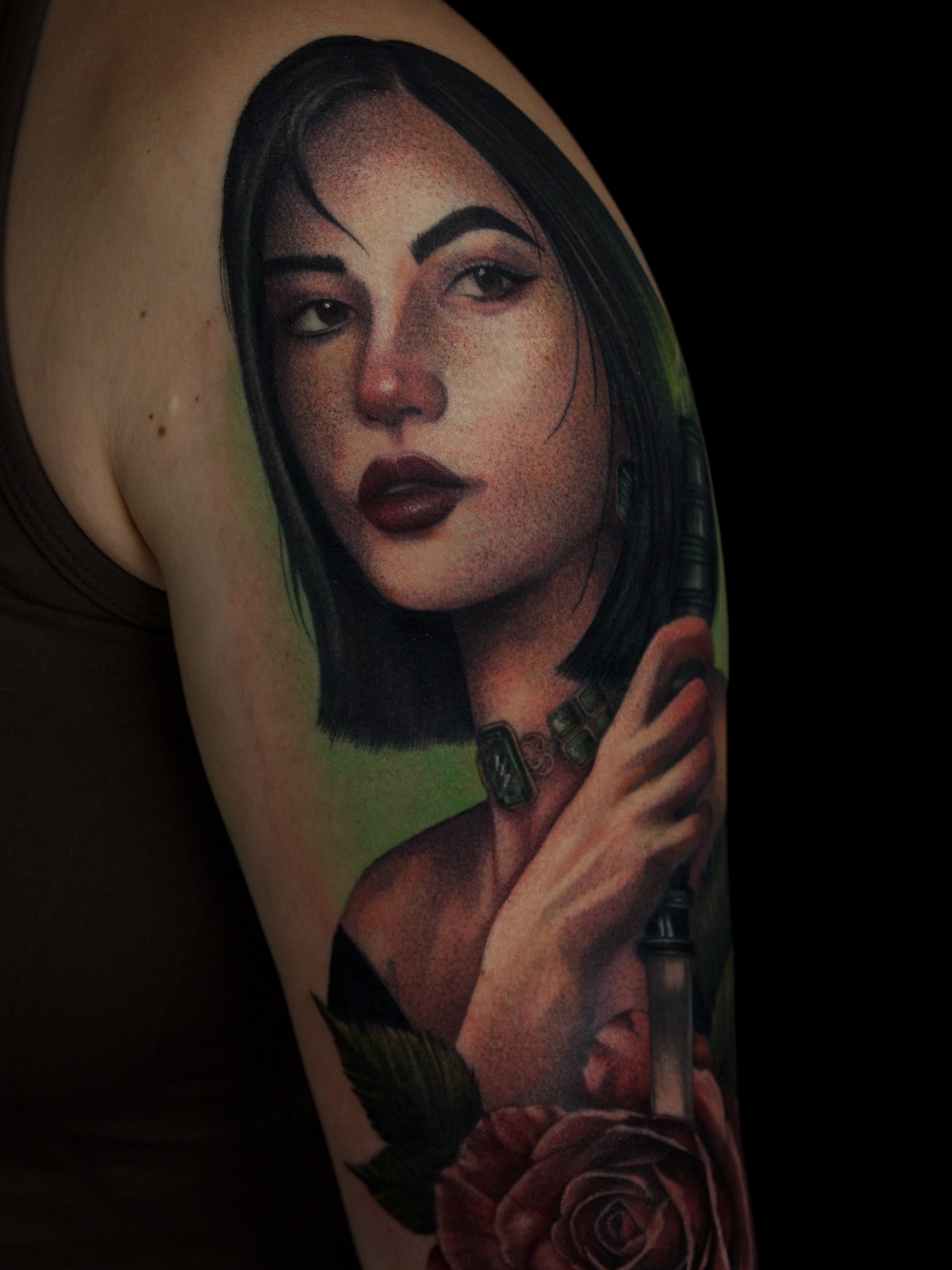 Portrait realism tattoo on the upper arm by caliope yiannos
