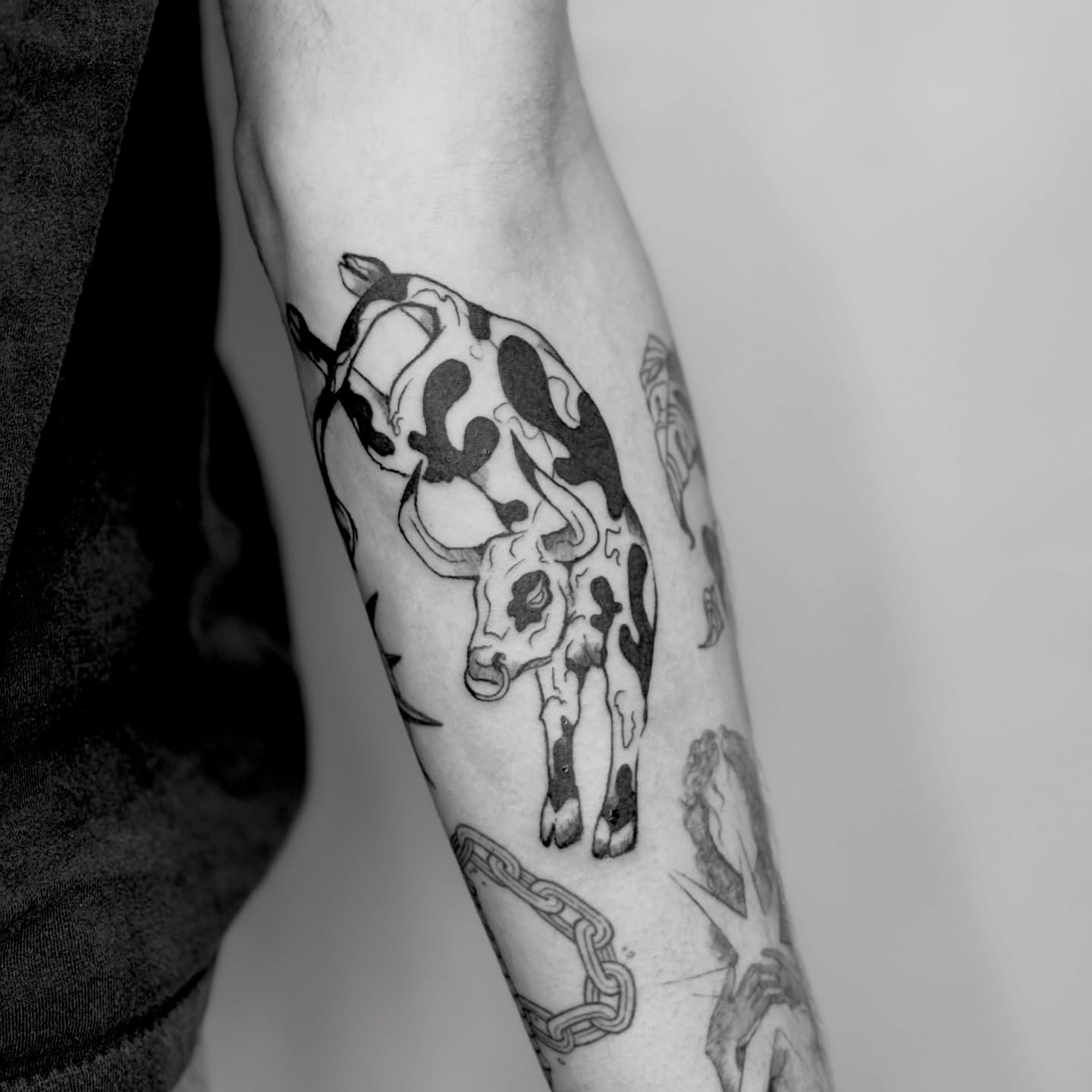 Bull black and grey tattoo on the forearm by Sarah