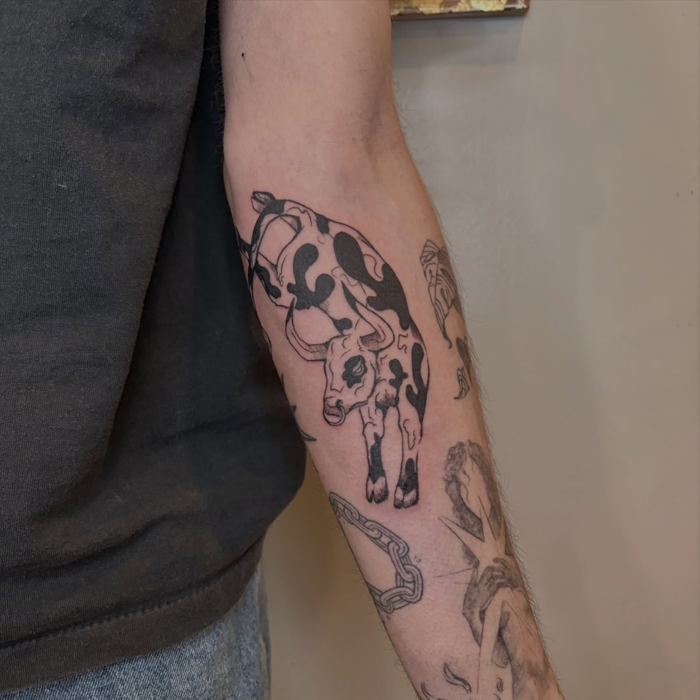 Bull black and grey tattoo on the forearm by Sarah