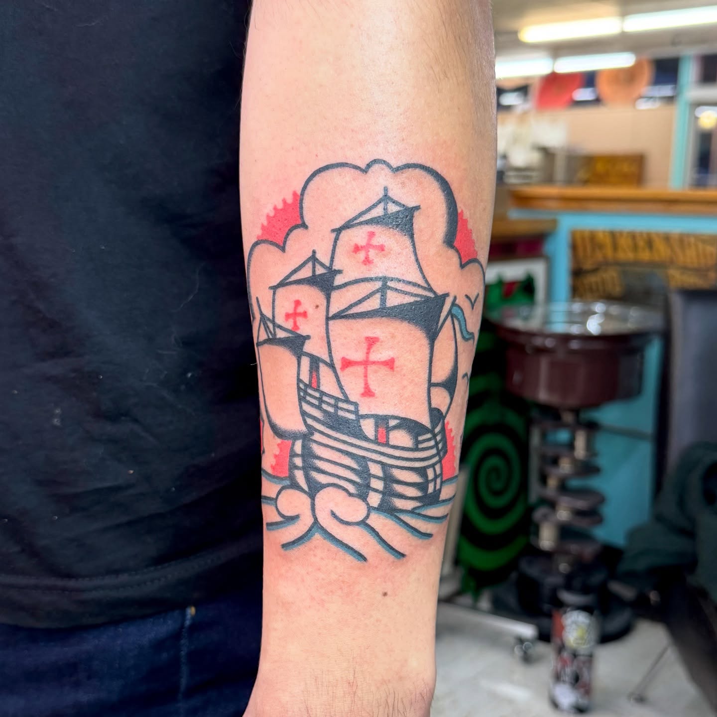 Ship with crosses American traditional tattoo on the forearm by Sam