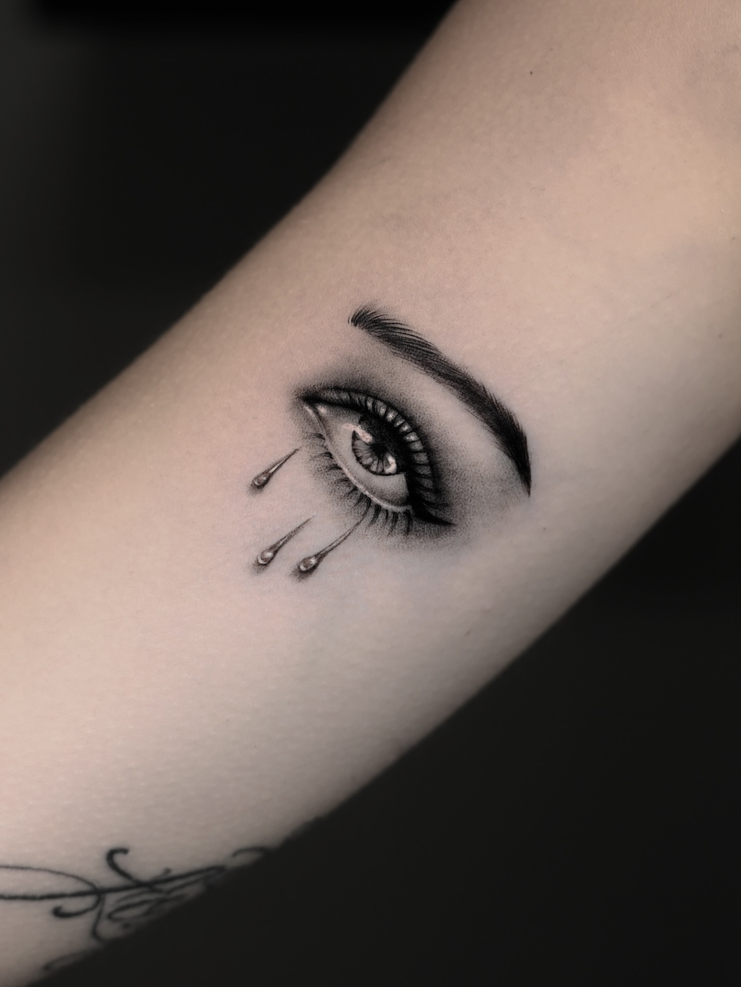Tearful eye realism tattoo on the forearm by hiba ⊹ atlanta tattoo artist, Johns Creek, Georgia