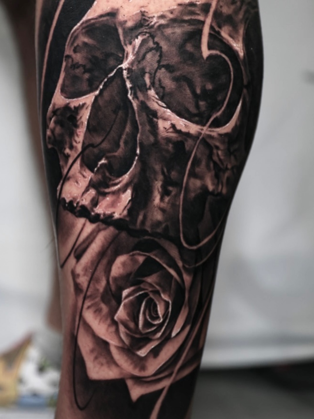 Skull and rose realism tattoo on the forearm by Matthew Brown, Londonderry, New Hampshire
