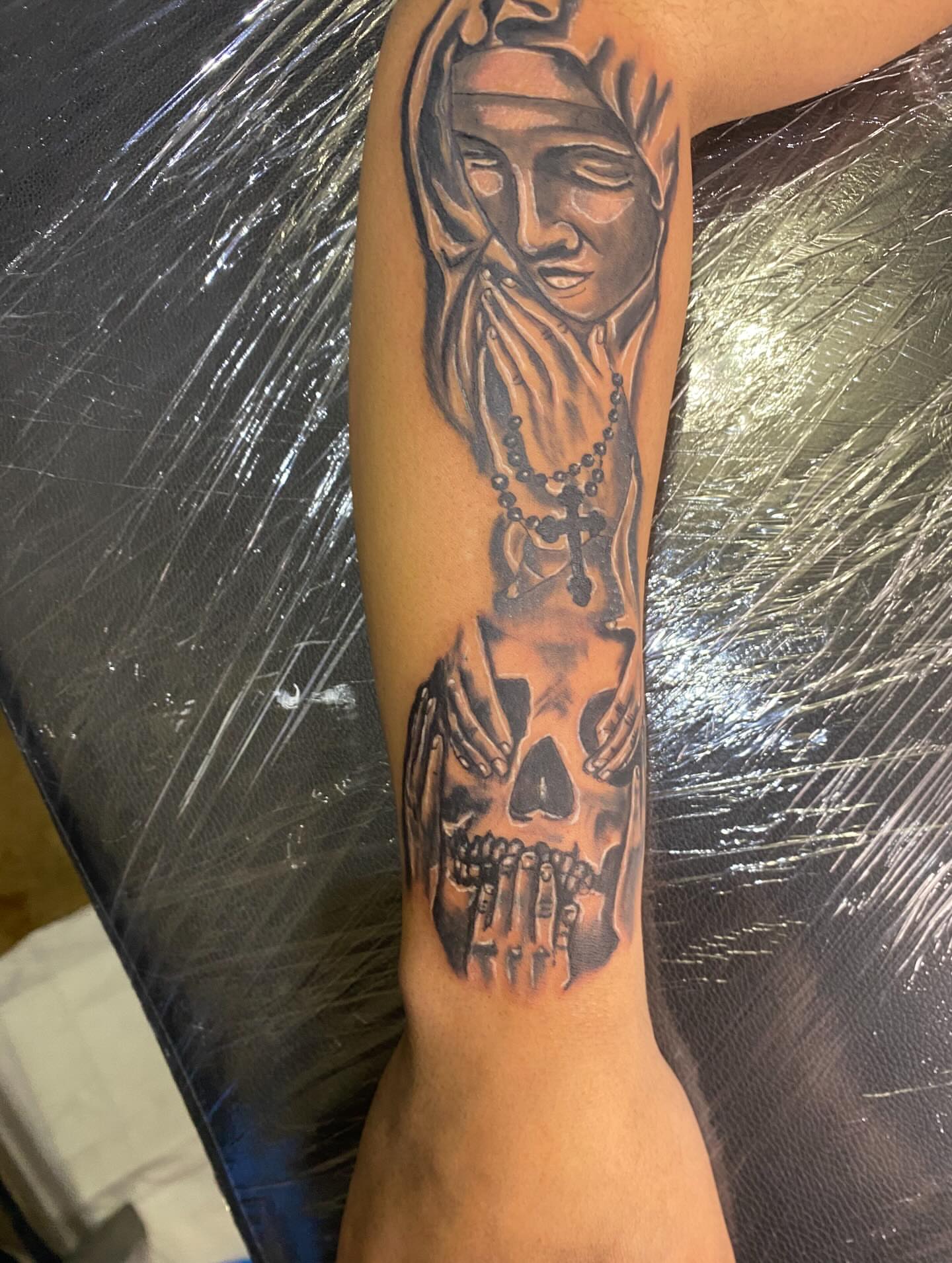 Woman with skull realism tattoo on the forearm by Illuminink.gallery