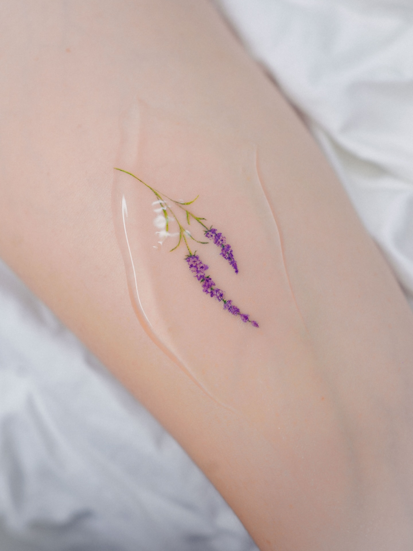 Lavender fine line tattoo on the forearm by Yeonji