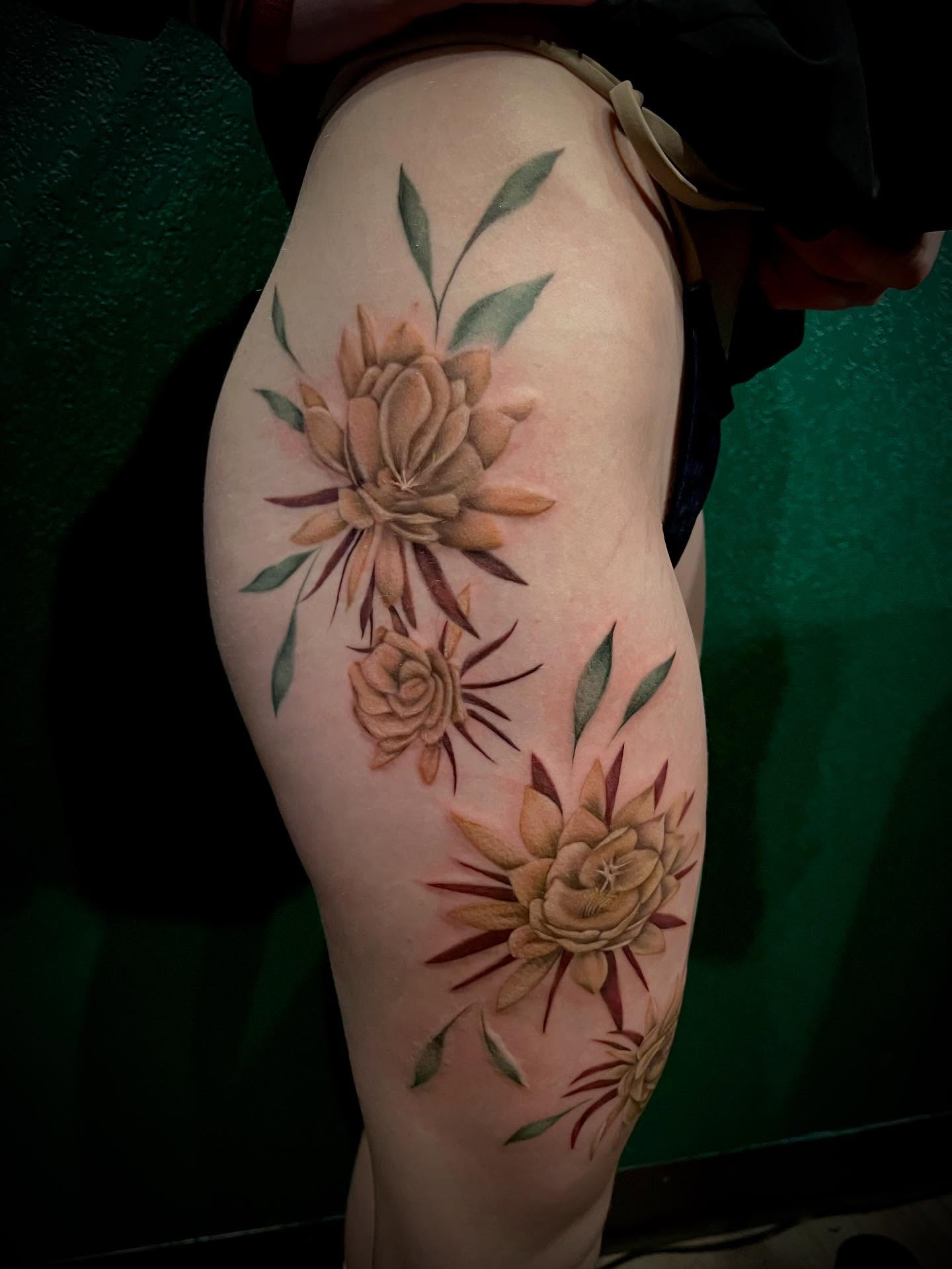 Floral arrangement realism tattoo on the thigh by Shelly Elissa Tattoos