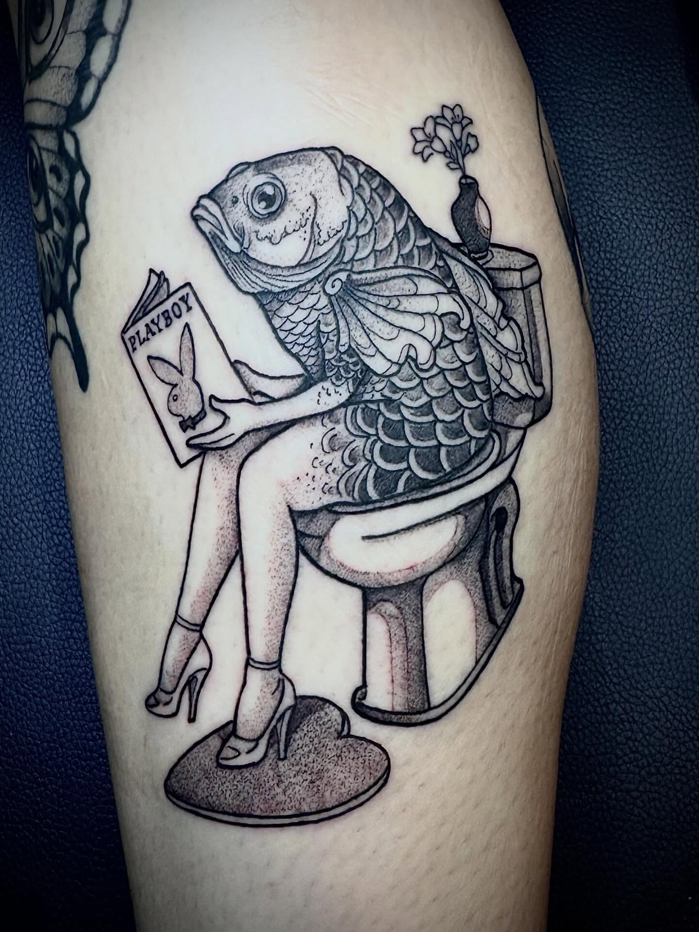 Fish reading Playboy dotwork tattoo on the thigh by 🏵
