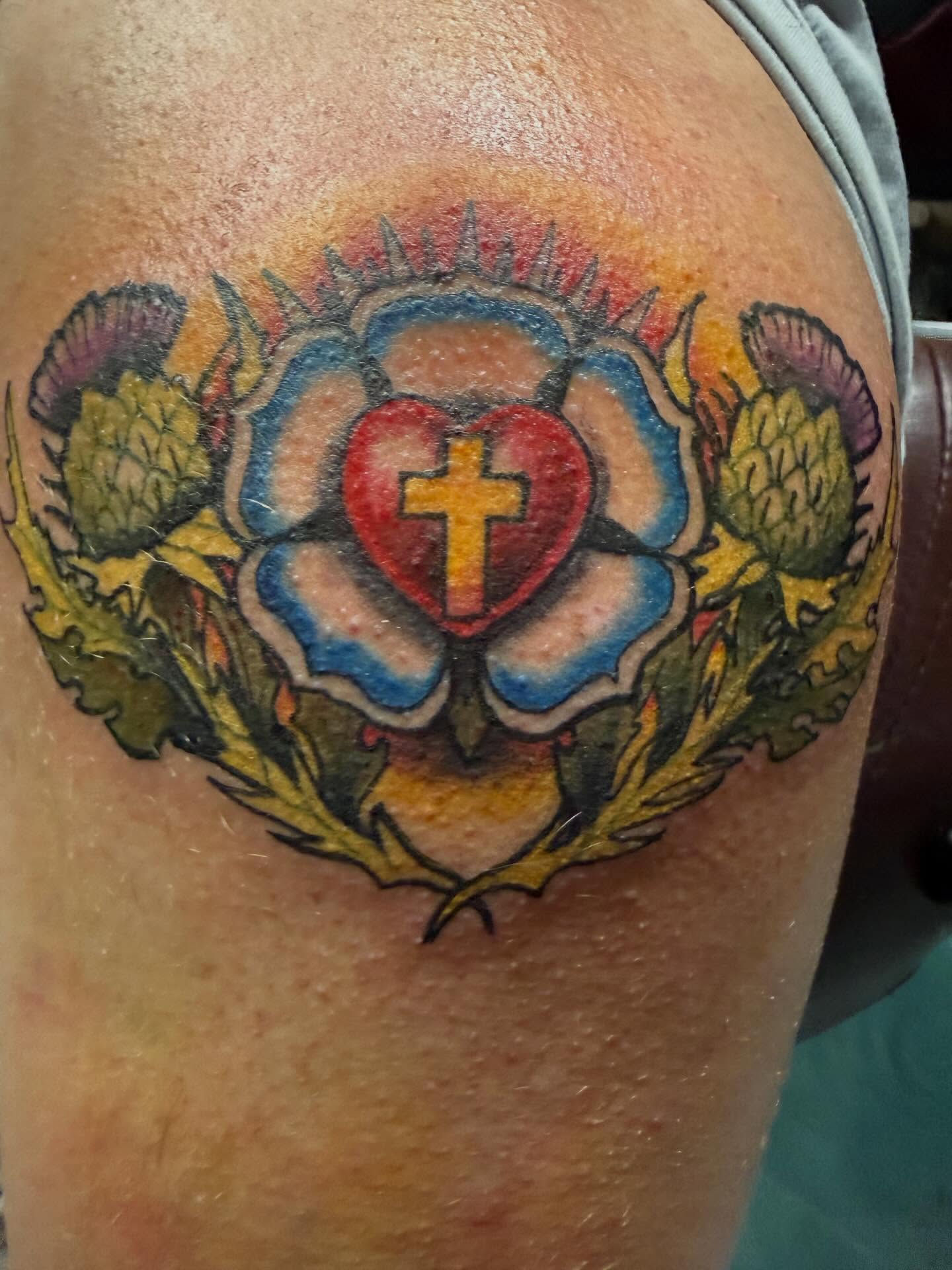 Heart with cross dotwork tattoo on the shoulder by Devon Beyer, Mission, Kansas