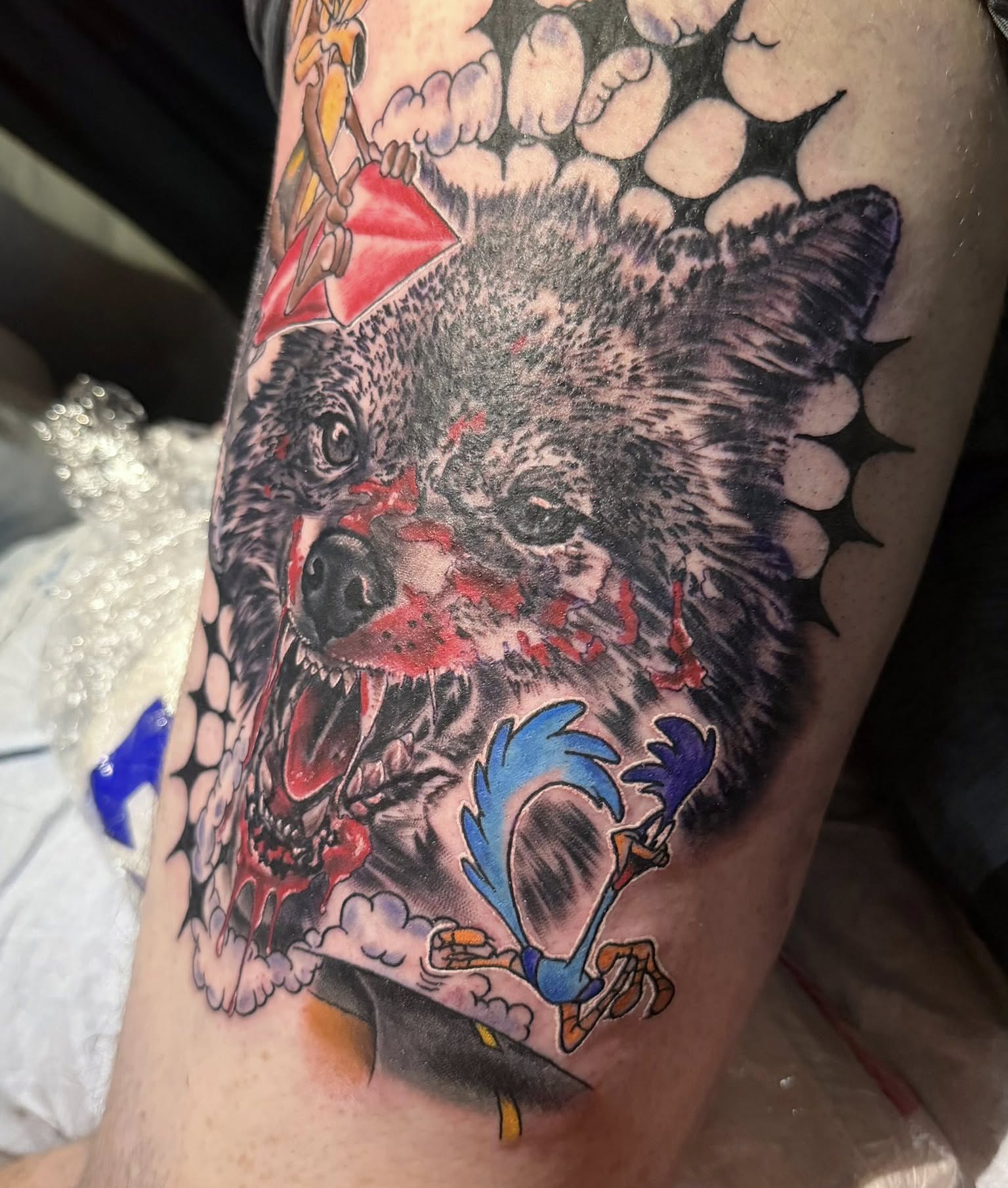 Wolf and rooster realism tattoo on the forearm by Corey Bailey, Stanton, Kentucky