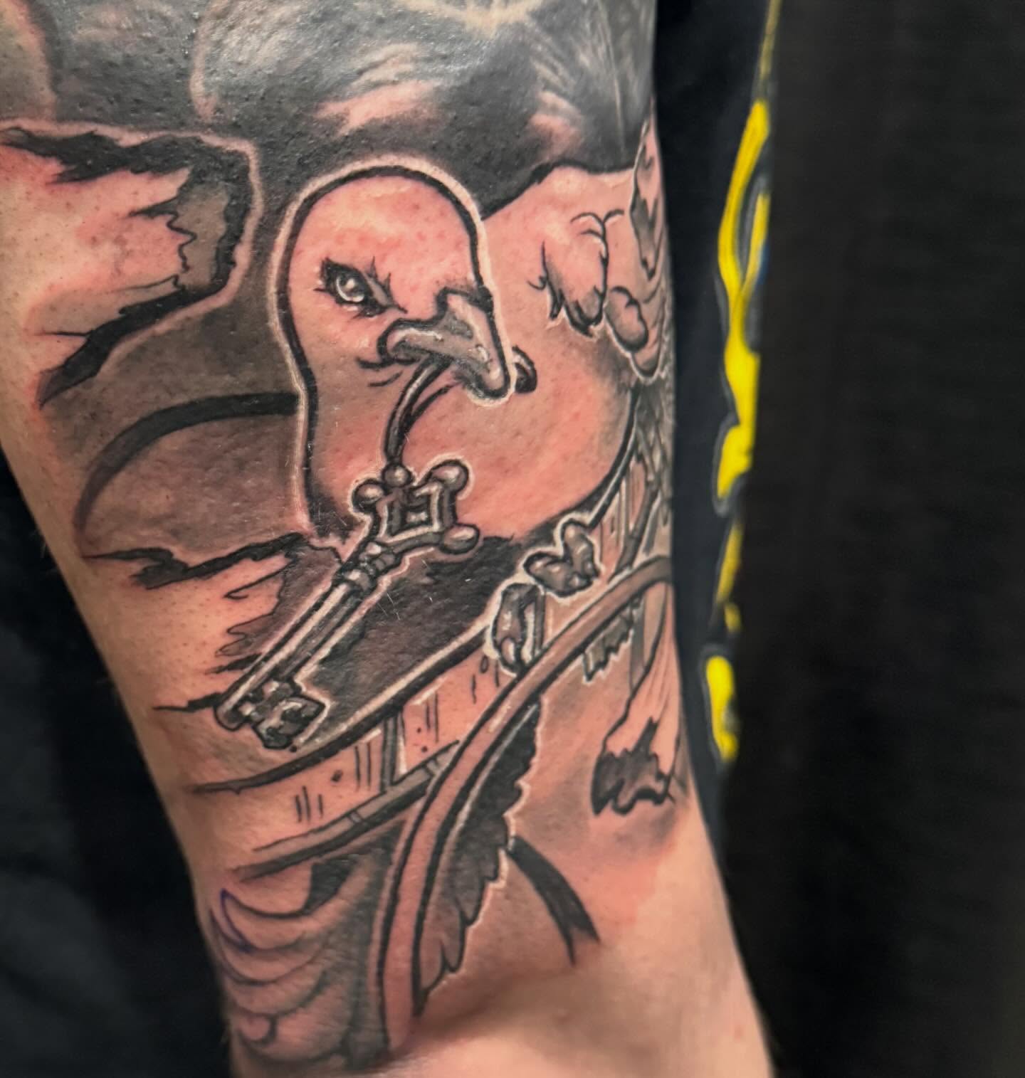 Bird and key American traditional tattoo on the forearm by Devon Beyer, Mission, Kansas