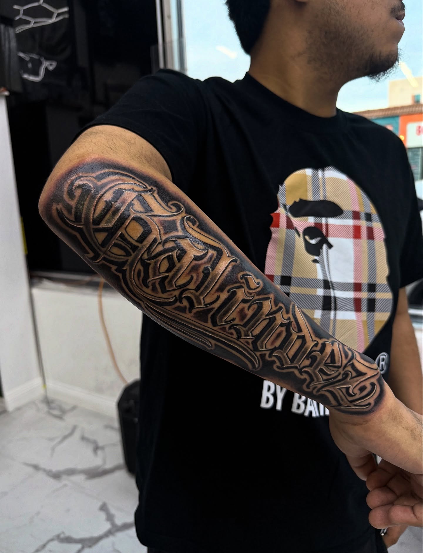 Script lettering lettering script tattoo on the forearm by @samg_tat2s, San Diego, California