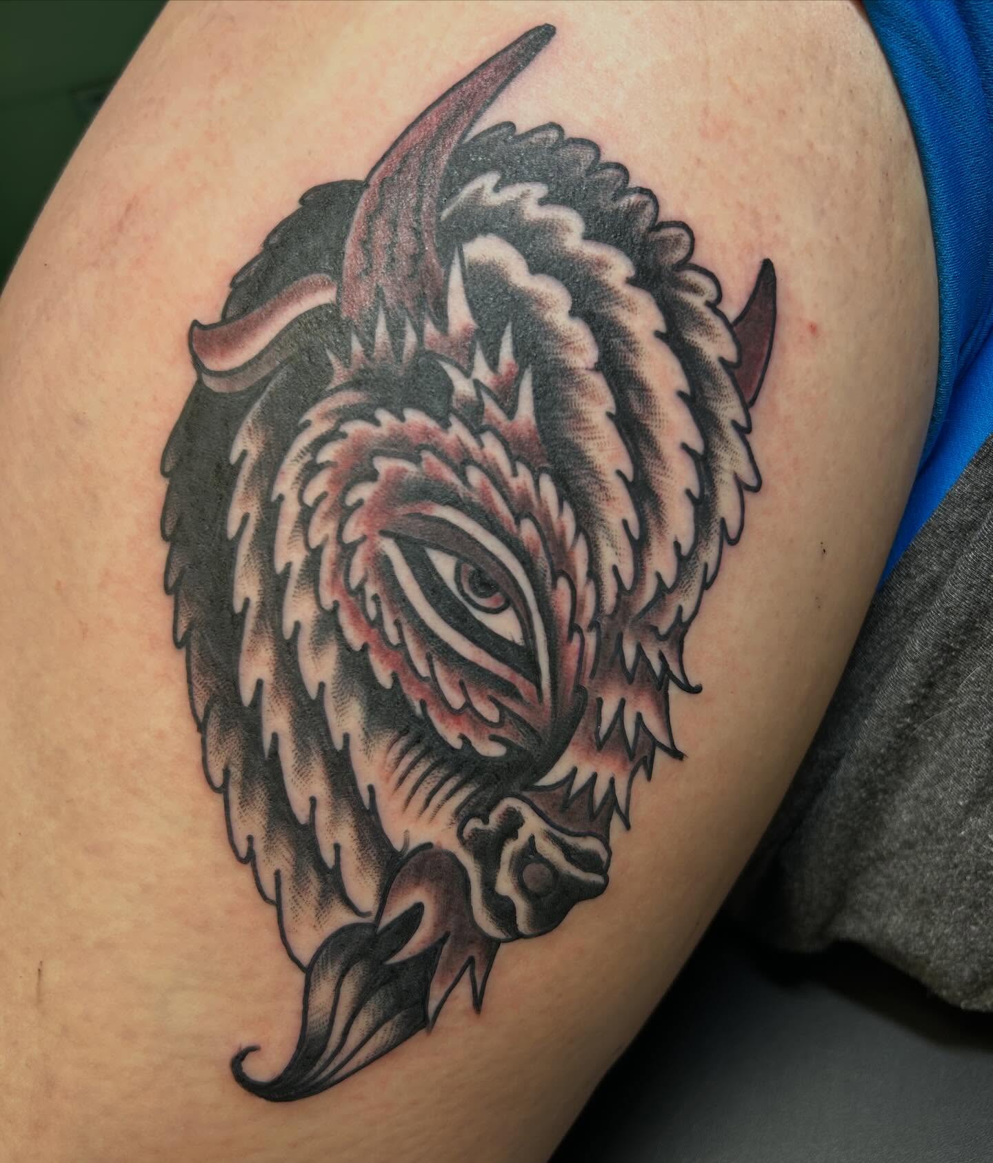 Bison American traditional tattoo on the shoulder by Erin Einhorn