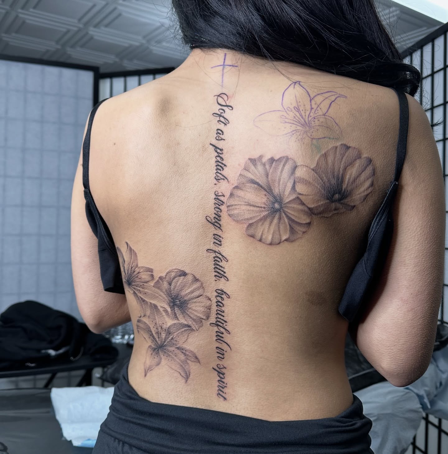 Flowers and script realism tattoo on the back by Dani B.