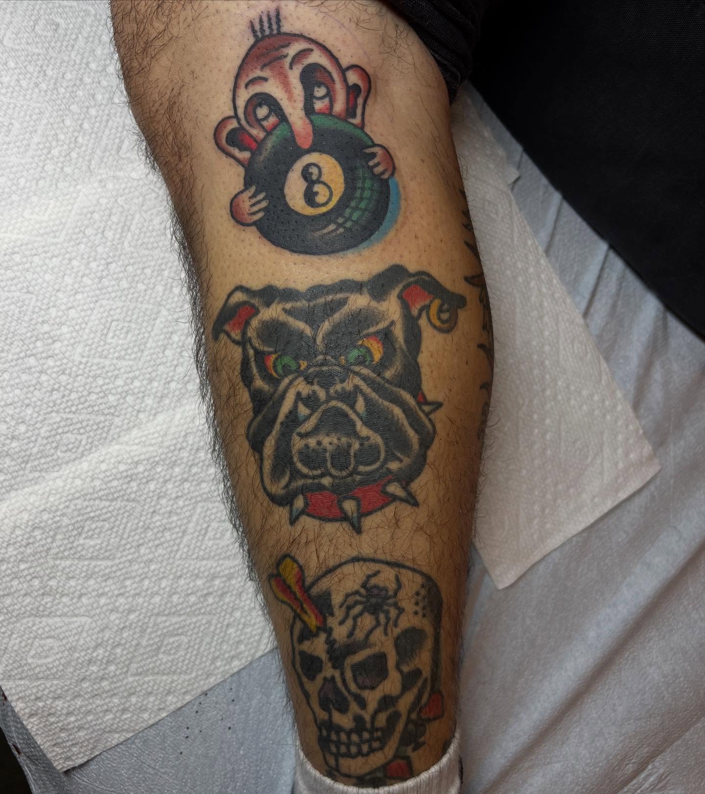 Bulldog, 8-ball, skull American traditional tattoo on the forearm by Tattoo
