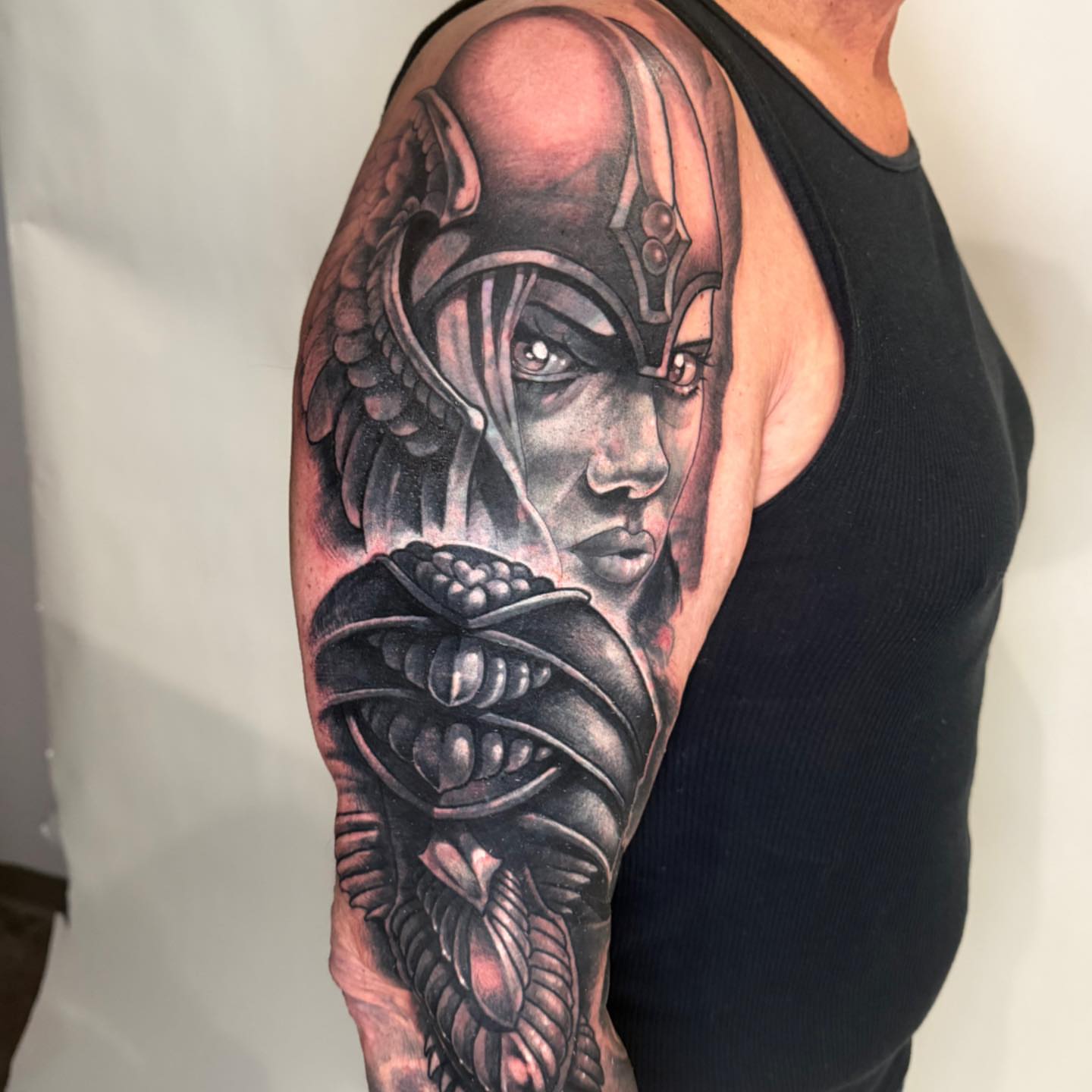 Female warrior realism tattoo on the upper arm by Tattoos by Aeron Herald Maurbjorn, Sioux