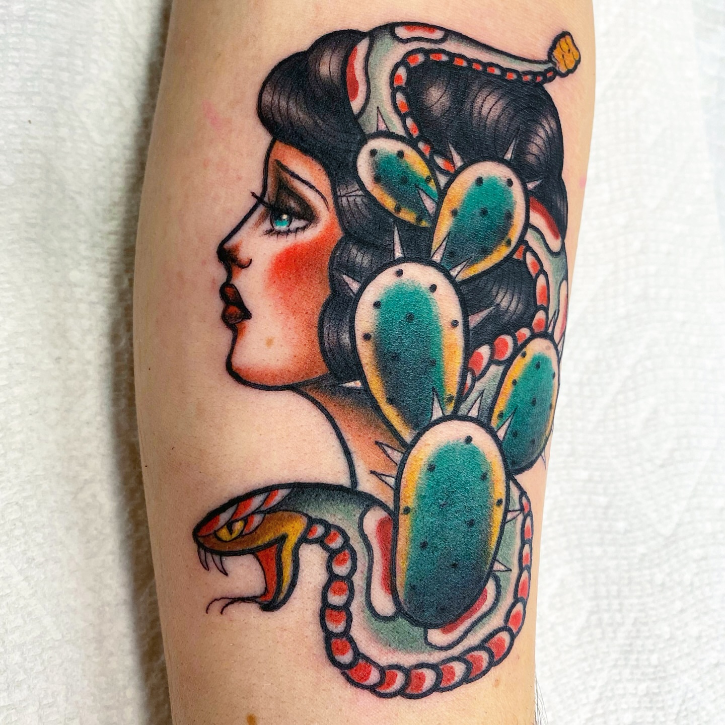 Woman with cactus American traditional tattoo on the forearm by Lisa Del Toro
