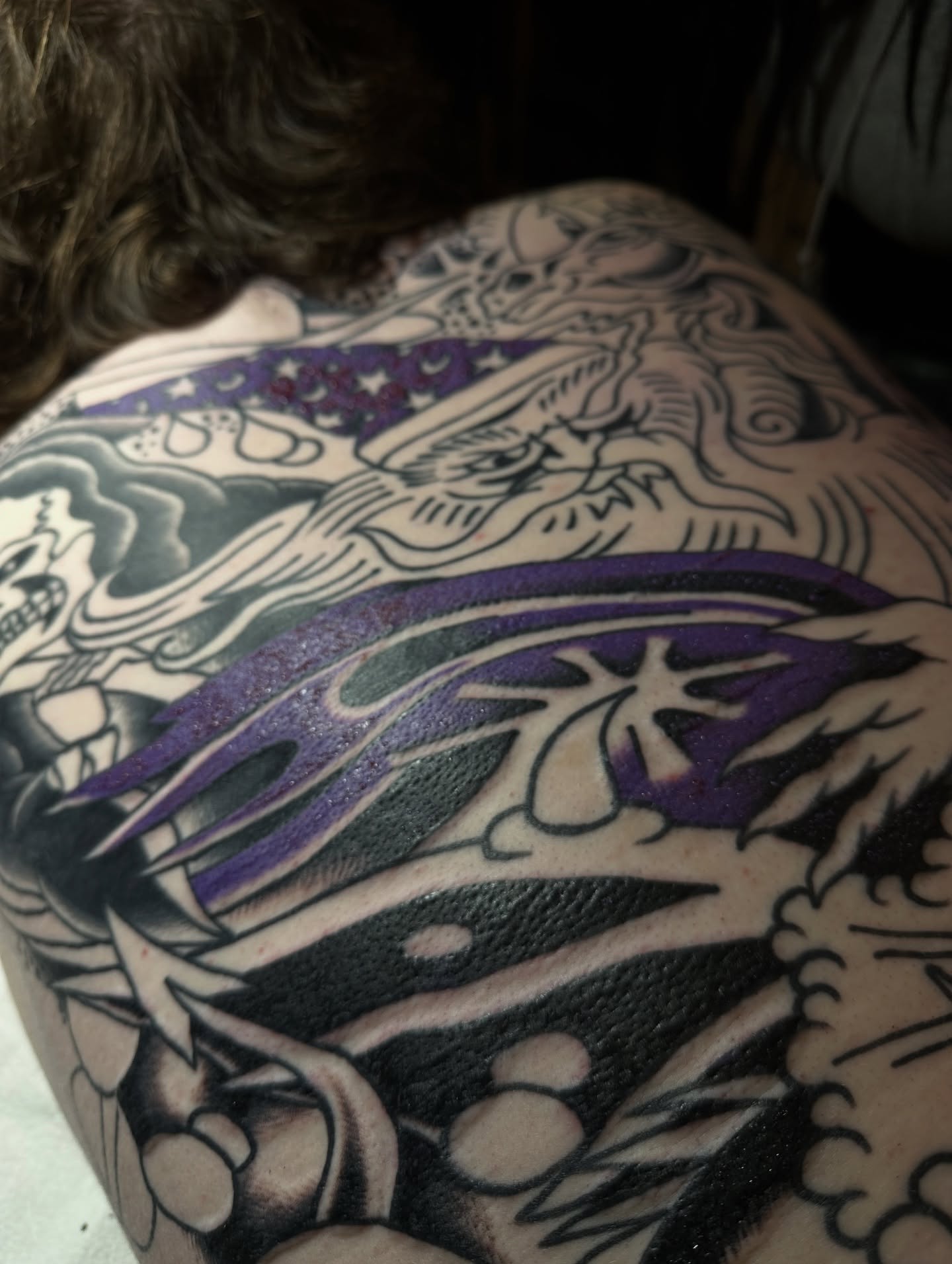 Dragon and flames American traditional tattoo on the back by Christian Rieben