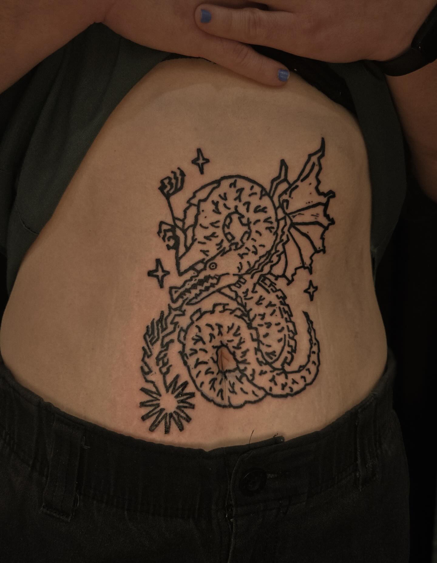 Dragon black and grey tattoo on the torso by ashley blyght