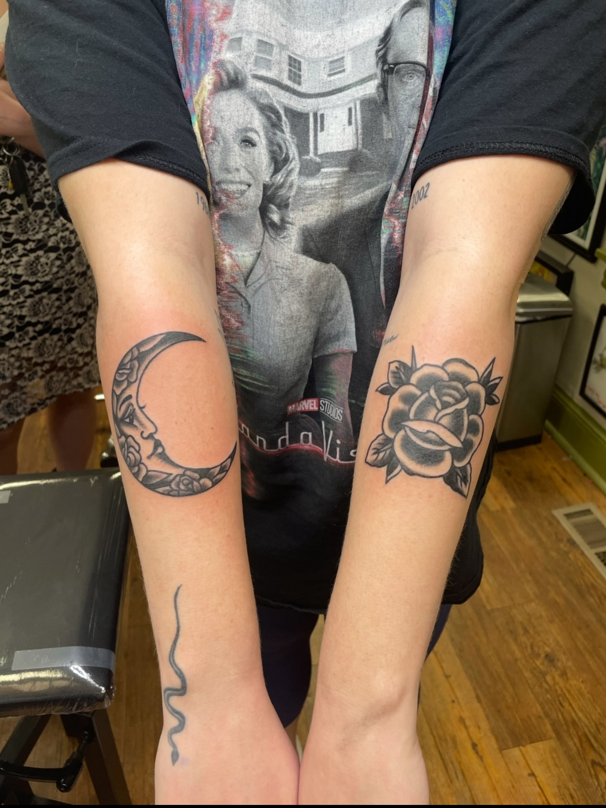 Moon and rose black and grey tattoo on the forearm by Mike DiCicco