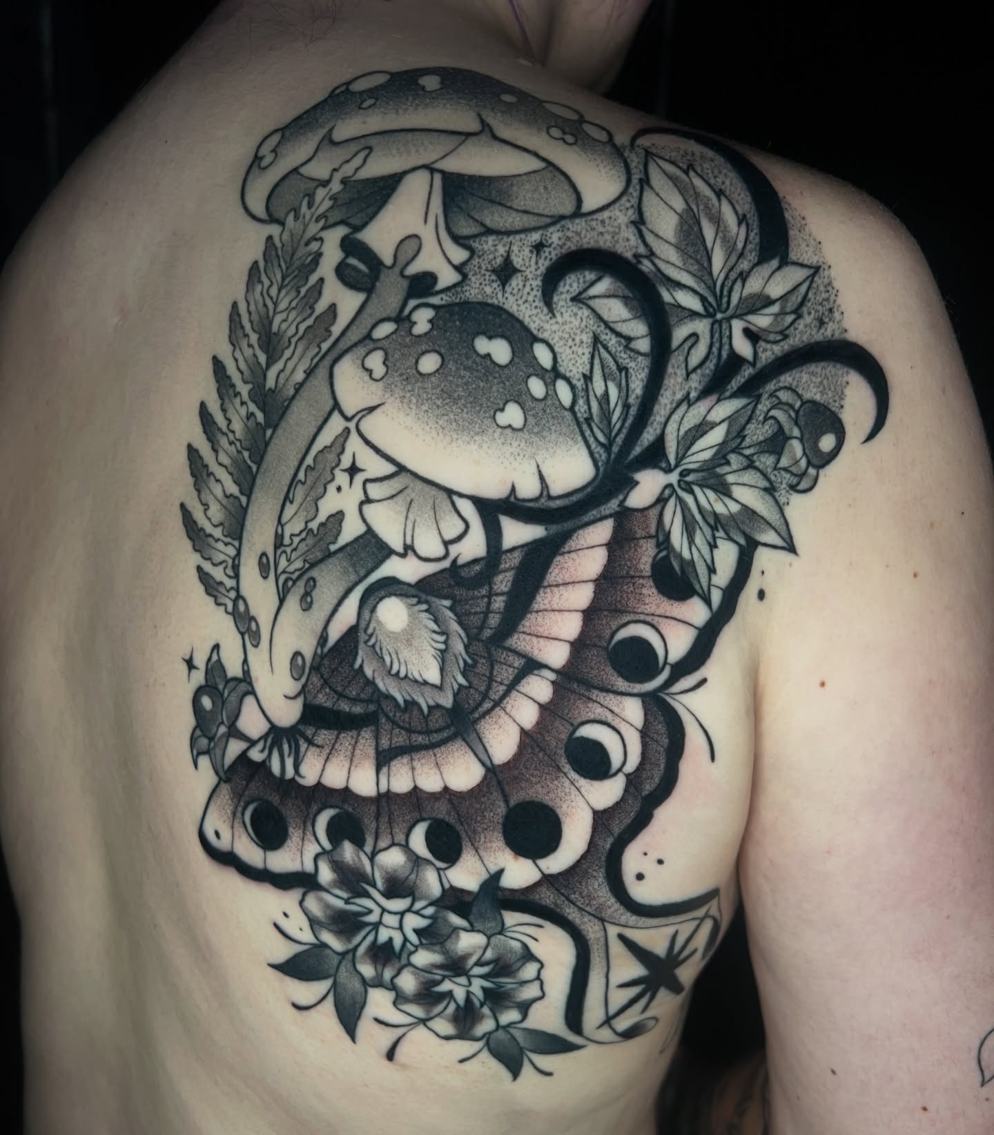 Mushroom and butterfly dotwork tattoo on the back by zoey sage ✦