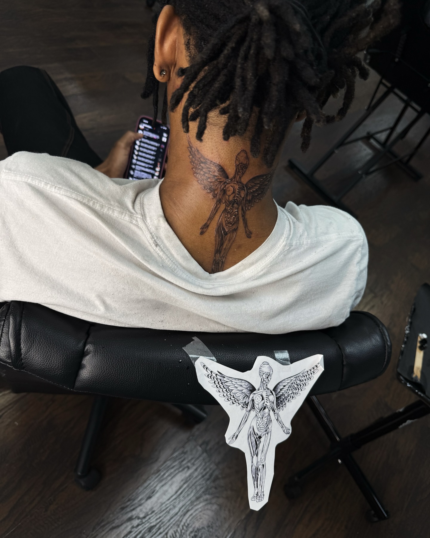 Angel black and grey tattoo on the neck by viktoria raquel