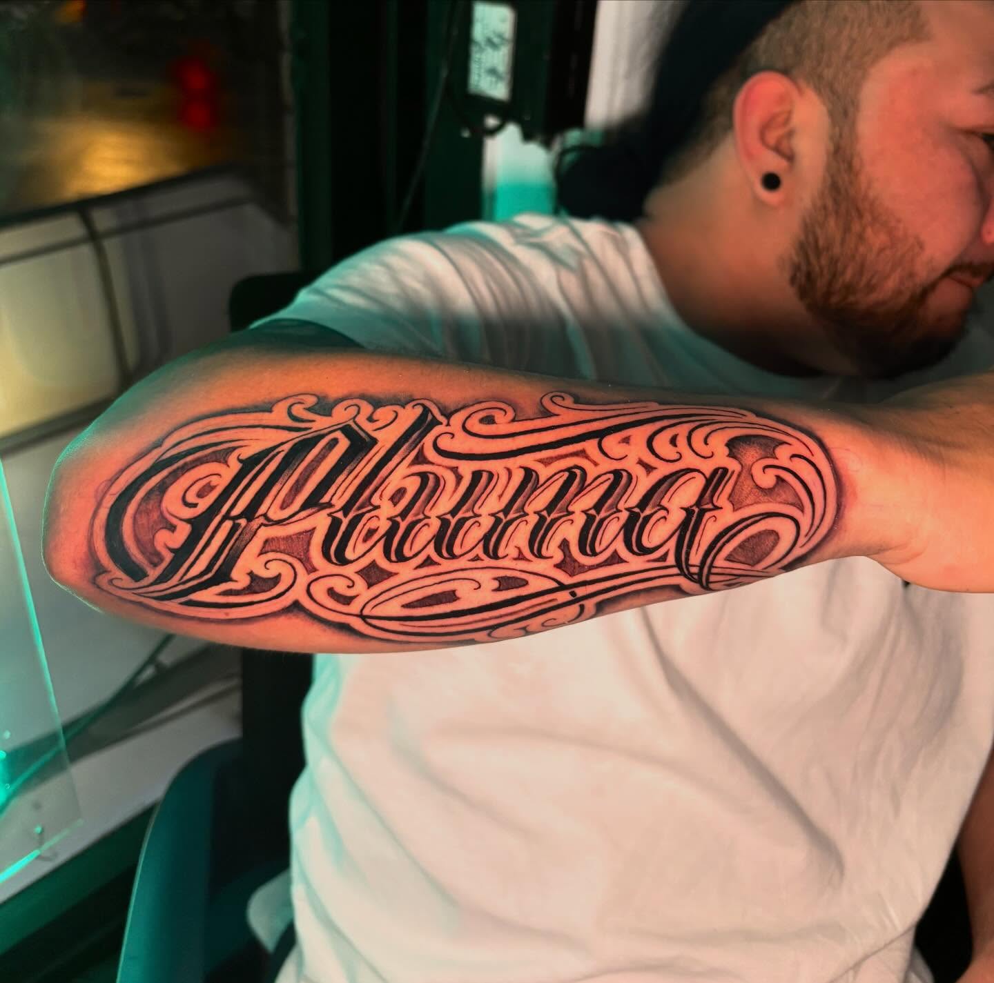 Script lettering lettering script tattoo on the forearm by Daero Tattoo, New York, New York