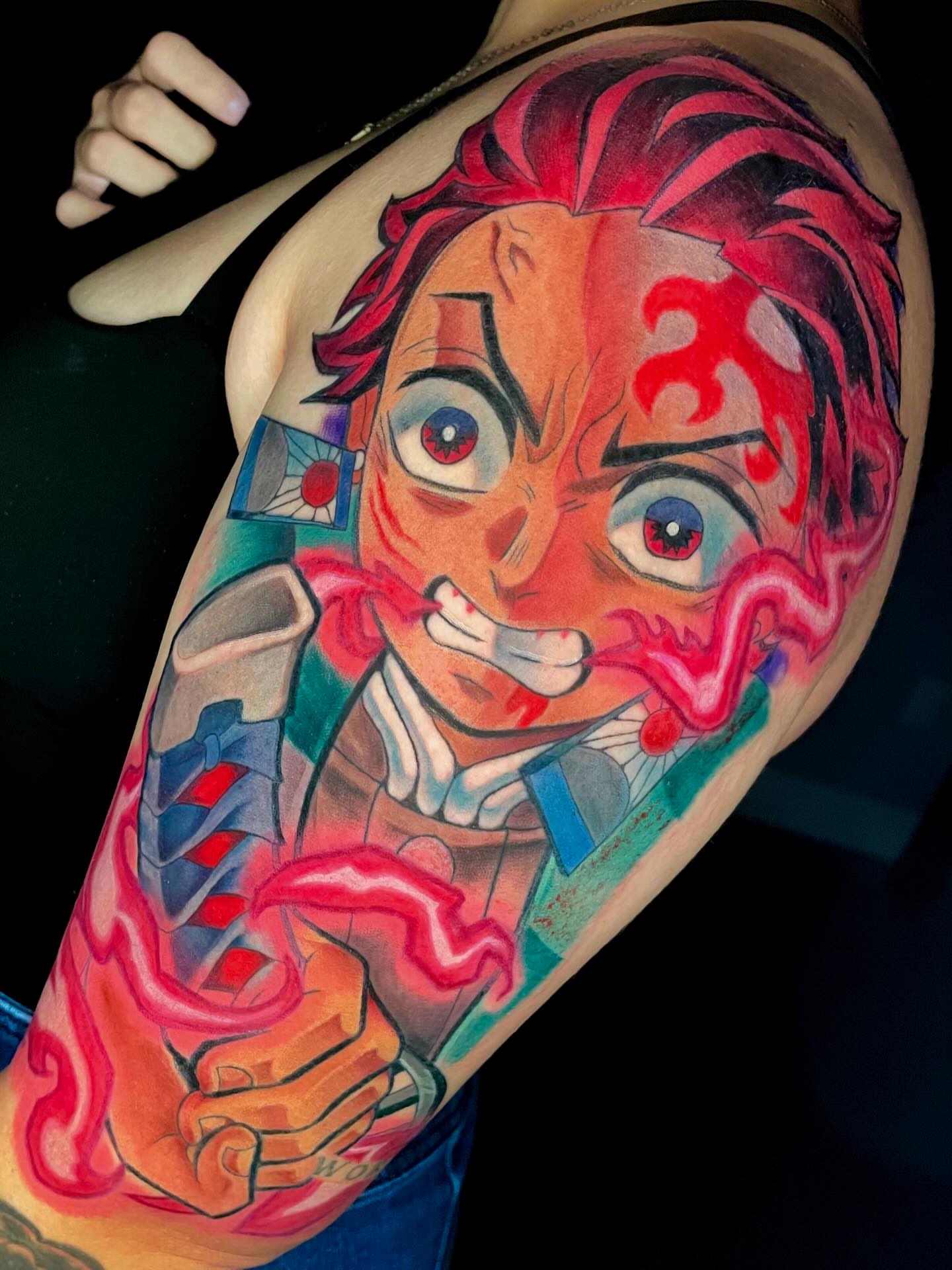 Anime character anime tattoo on the upper arm by Xena