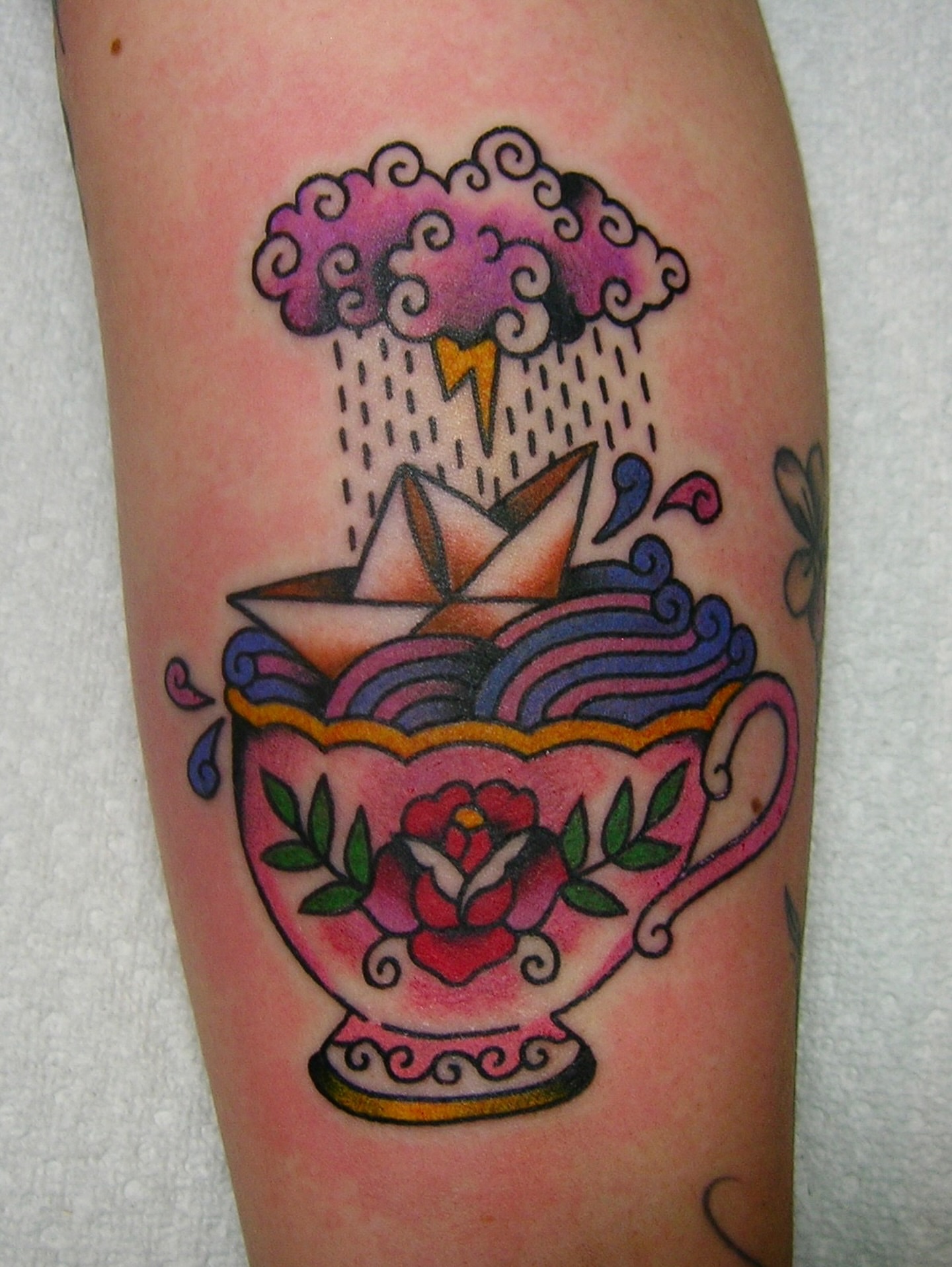 Teacup and paper boat American traditional tattoo on the forearm by edith🌷, Murfreesboro, Tennessee