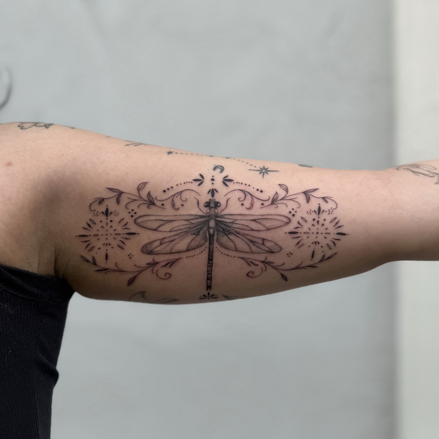 Dragonfly black and grey tattoo on the forearm by Raleigh tattoo artist, Raleigh, North Carolina