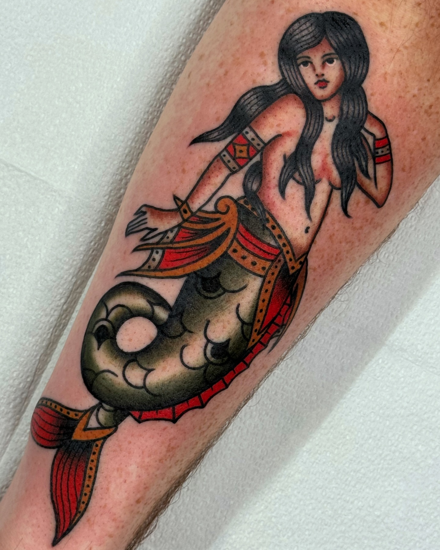 Mermaid American traditional tattoo on the forearm by Cory Craft