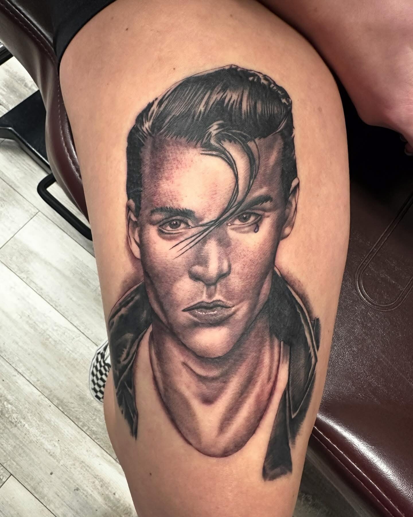 Portrait realism tattoo on the thigh by Isaac Ortiz-Riendeau